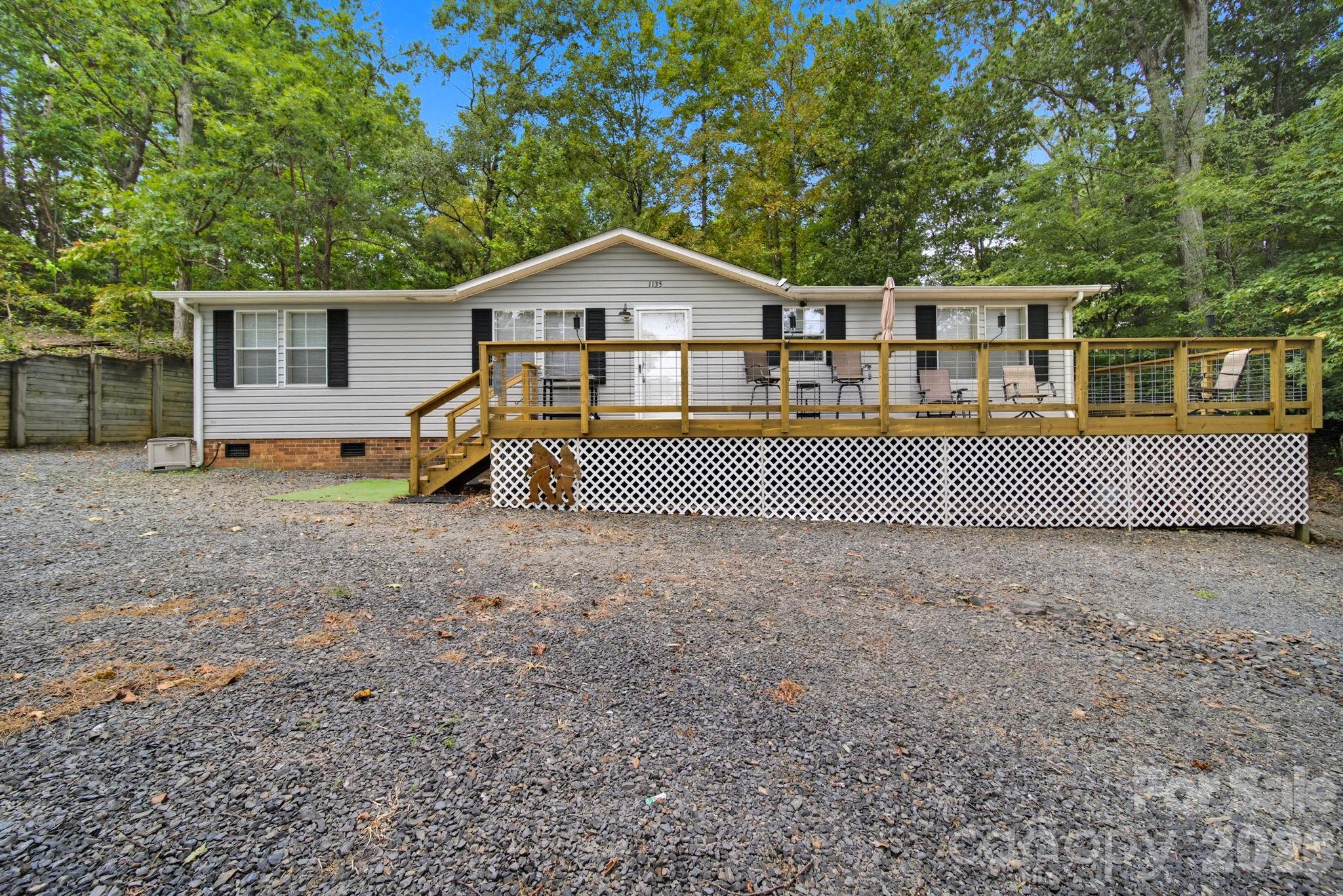 *Sellers are now offering $5000 in concessions for Roof replacement!*  Fully Furnished Lake-View Home – YES that's right all furniture, décor, appliances, security cameras, and even a golf cart convey with this well-maintained 3-bedroom, 2-bath manufactured doublewide home offering beautiful views of the lake.
The updated home consists of 3 lots, one of which was cleared in 2025 to ensure plenty of parking for your boat. Along with a brand new HVAC in April 2026 the home features updated LVP flooring throughout and refreshed living and kitchen areas designed for comfortable everyday living. The split-bedroom layout offers generously sized bedrooms and two full bathrooms, providing comfortable spaces.
Enjoy time with friends and family from the newly built, oversized front deck, an ideal space for entertaining, relaxing, or enjoying morning coffee while taking in the scenery.
A voluntary HOA provides access to the community boat landing and swimming area, offering convenient opportunities for boating, fishing, and enjoying Badin Lake.
Whether used as a full-time residence or a weekend retreat, this property offers lake views, functional living space, and the convenience of being sold fully furnished. 
Homes like this don't come along often! Call today to schedule your private tour.