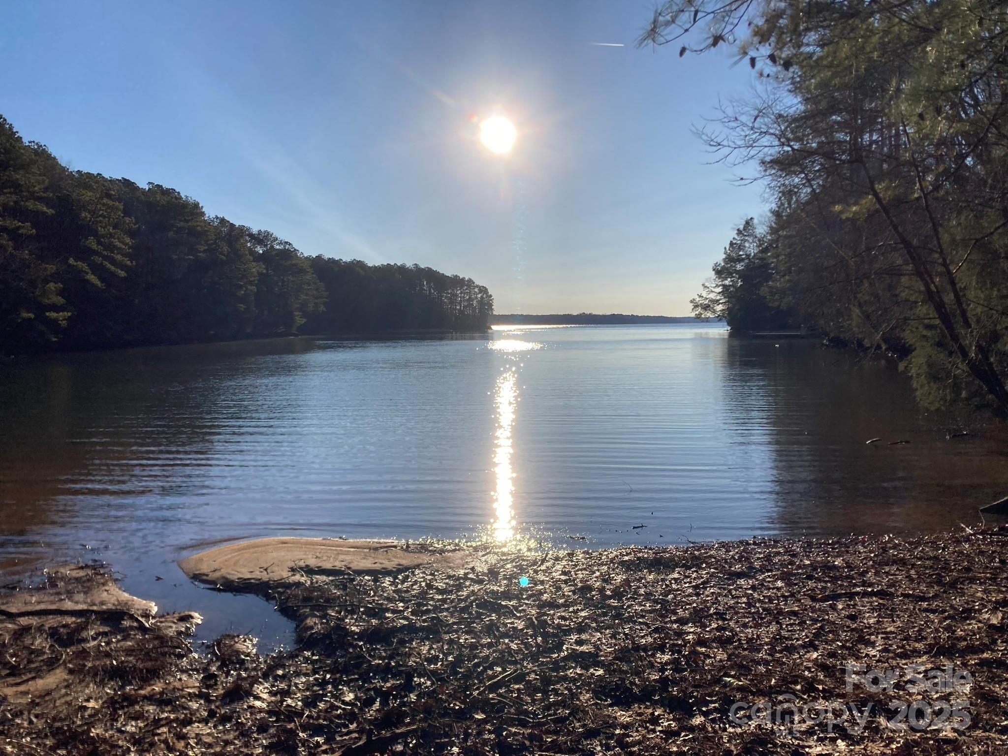Note- Perc test completed and septic permit approved 

Welcome to Nestled on a gentle point at the very tip of the lake, this 0.70-acre lot offers floor-to-ceiling views on three sides—sunrise and sunset reflecting off the water and 360° vistas.

Deep-water frontage: Secure solid footing and easy float access even when lake levels fluctuate. Ideal depth for swim, fish, canoe/kayak launch, or boat mooring.

Lot Size: 0.70 acres (~30,492?sq?ft), leading to peninsula frontage with minimal shoreline shared.

Shoreline: Gently sloped to water; comprised of sand/gravel at your private beach zone.

Why This Lot Stands Out

Peninsula privacy: With neighbors behind and to either side, you’ll enjoy a tranquil, resort-like setting without the expense or density of island property.

Outdoor play and peace: Fish off your dock in the morning, kayak the bay at midday, gather by the firepit at golden hour—plenty of room to roam on your nearly 1/5 acre tip-slot shores.