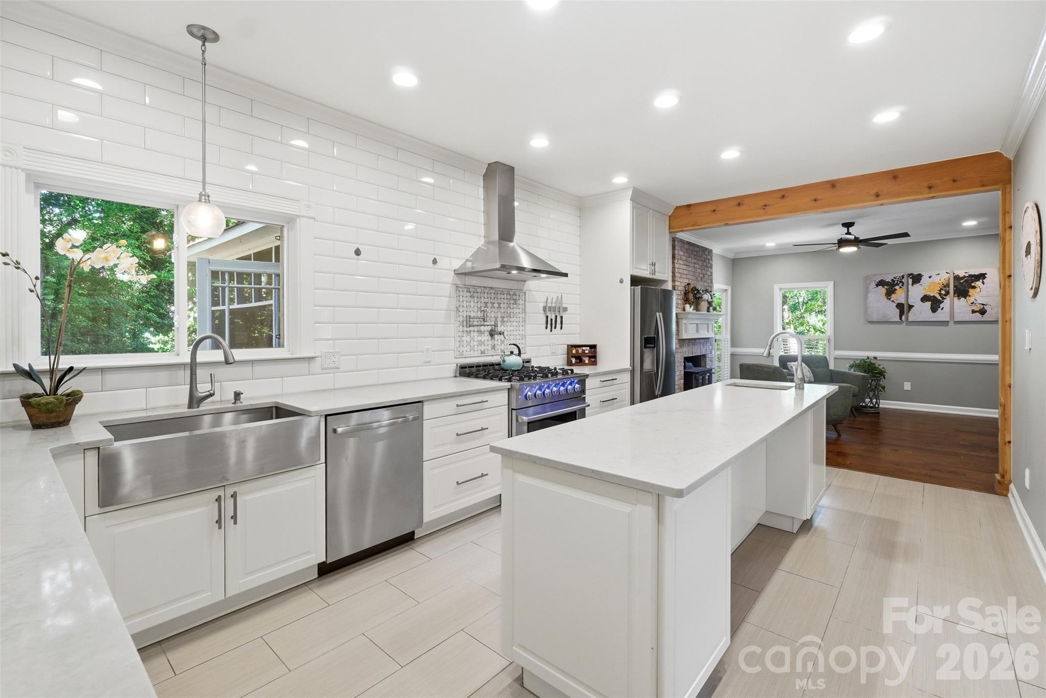 Welcome home to this beautifully updated 4-bedroom, 2.5-bath residence tucked away on a private cul-de-sac lot in one of northwest Charlotte's most convenient locations. With over 2,700 square feet of thoughtfully designed living space, this home perfectly blends modern upgrades with timeless charm.

The heart of the home is the gourmet kitchen, featuring a professional 6-burner gas range, farmhouse sink, prep sink, center island, stainless steel appliances, and designer tile backsplash, ideal for both everyday living and entertaining. The open-concept main level showcases decorative wood beams, crown molding, plantation shutters, and a cozy wood-burning fireplace.

Retreat to the spacious primary suite with a beautifully remodeled bath, frameless glass shower, and custom closet system. Upstairs, you'll also find generously sized secondary bedrooms and a large bonus room that can easily serve as a fourth bedroom, home office, or media room.

Step outside to your own backyard retreat with a screened porch, expansive deck, paver patio, and fenced yard, perfect for relaxing or hosting friends and family!

Conveniently located just minutes from I-485, the airport, golf courses, shopping, dining, and Uptown, this move-in ready gem truly checks all the boxes offering the perfect combination of comfort, style, and accessibility.