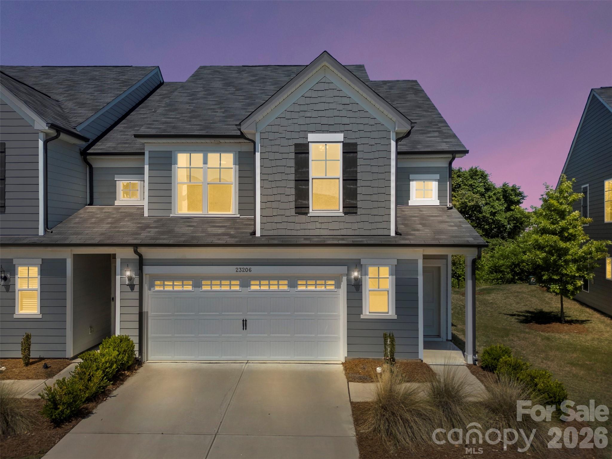 END-UNIT townhome in the Pringle Towns community in Steele Creek just minutes from Charlotte Premium Outlets, dining, entertainment, and convenient interstate access. This spacious 3-bedroom, 2.5-bath home features a bright, open-concept floor plan and has brand new carpet installed upstairs. The main level showcases stylish laminate flooring throughout, a spacious Great Room, dining area, and an upgraded kitchen complete with stainless steel appliances, 42” cabinetry, quartz countertops, designer backsplash, pendant lighting, and modern hardware. Step outside to enjoy the private rear patio backing up to trees. Upstairs features brand new carpet throughout and a spacious Owner’s Suite offering a luxurious retreat with a walk-in tiled shower, upgraded quartz vanity countertops, tile flooring, and upgraded cabinetry. Two additional bedrooms, a full secondary bathroom with upgraded finishes, and a conveniently located laundry room complete the second level.As an end unit, this home offers additional windows and abundant natural light throughout. Additional upgrades include crown molding, detailed window trim, and thoughtful designer touches throughout the home. Residents of Pringle Towns enjoy a resort style community pool and cabana. Move-in ready and loaded with upgrades — this is a must-see!