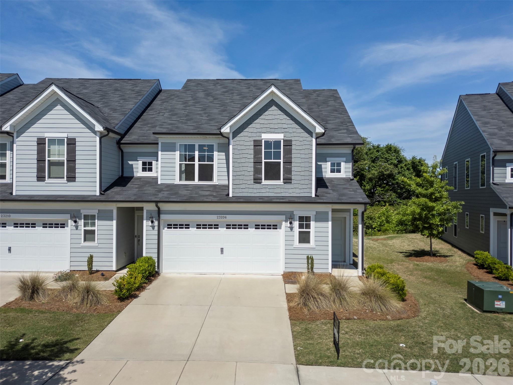 END-UNIT townhome in the Pringle Towns community in Steele Creek just minutes from Charlotte Premium Outlets, dining, entertainment, and convenient interstate access. This spacious 3-bedroom, 2.5-bath home features a bright, open-concept floor plan and has brand new carpet installed upstairs. The main level showcases stylish laminate flooring throughout, a spacious Great Room, dining area, and an upgraded kitchen complete with stainless steel appliances, 42” cabinetry, quartz countertops, designer backsplash, pendant lighting, and modern hardware. Step outside to enjoy the private rear patio backing up to trees. Upstairs features brand new carpet throughout and a spacious Owner’s Suite offering a luxurious retreat with a walk-in tiled shower, upgraded quartz vanity countertops, tile flooring, and upgraded cabinetry. Two additional bedrooms, a full secondary bathroom with upgraded finishes, and a conveniently located laundry room complete the second level.As an end unit, this home offers additional windows and abundant natural light throughout. Additional upgrades include crown molding, detailed window trim, and thoughtful designer touches throughout the home. Residents of Pringle Towns enjoy a resort style community pool and cabana. Move-in ready and loaded with upgrades — this is a must-see!