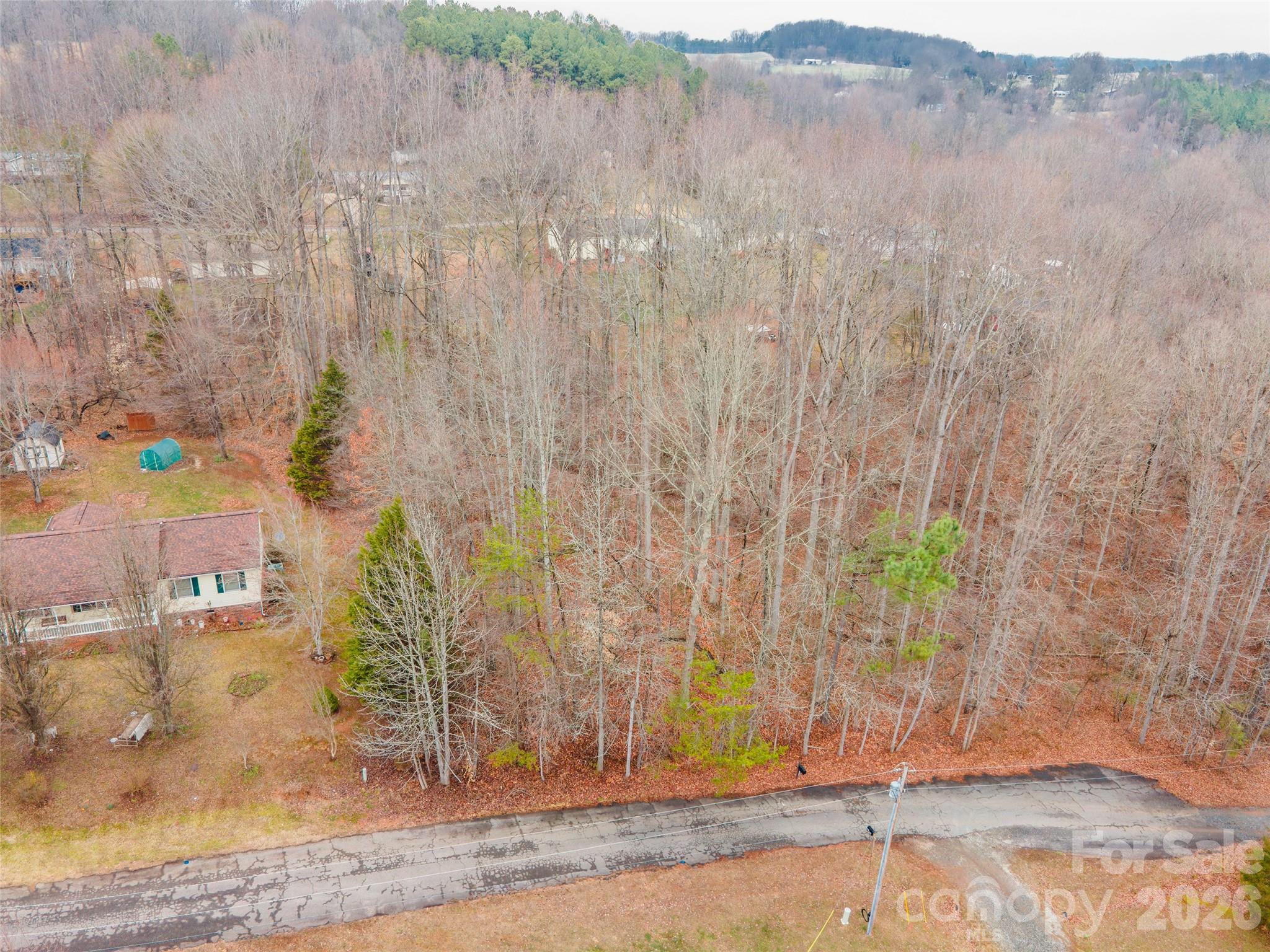 Looking for the perfect spot to build your dream home? This beautiful, wooded lot offers a quaint country setting that is still highly accessible to conveniences and interstates! It is a true blank canvas, ready for your custom construction or modular home - minimum of build of 1000 sq ft. You have the flexibility to clear your ideal footprint while keeping mature trees for natural privacy. Some slope makes it ideal for a basement foundation if desired. Located on a cul-de-sac with no through traffic. County water is available at the street (standard tap fee applies); a private septic system is needed.

Don't let this prime piece of real estate slip away! Lots in this area go fast. Stop dreaming and start building! Take the first step toward your new home, grab your builder and walk the property today. Inquire before it's gone!