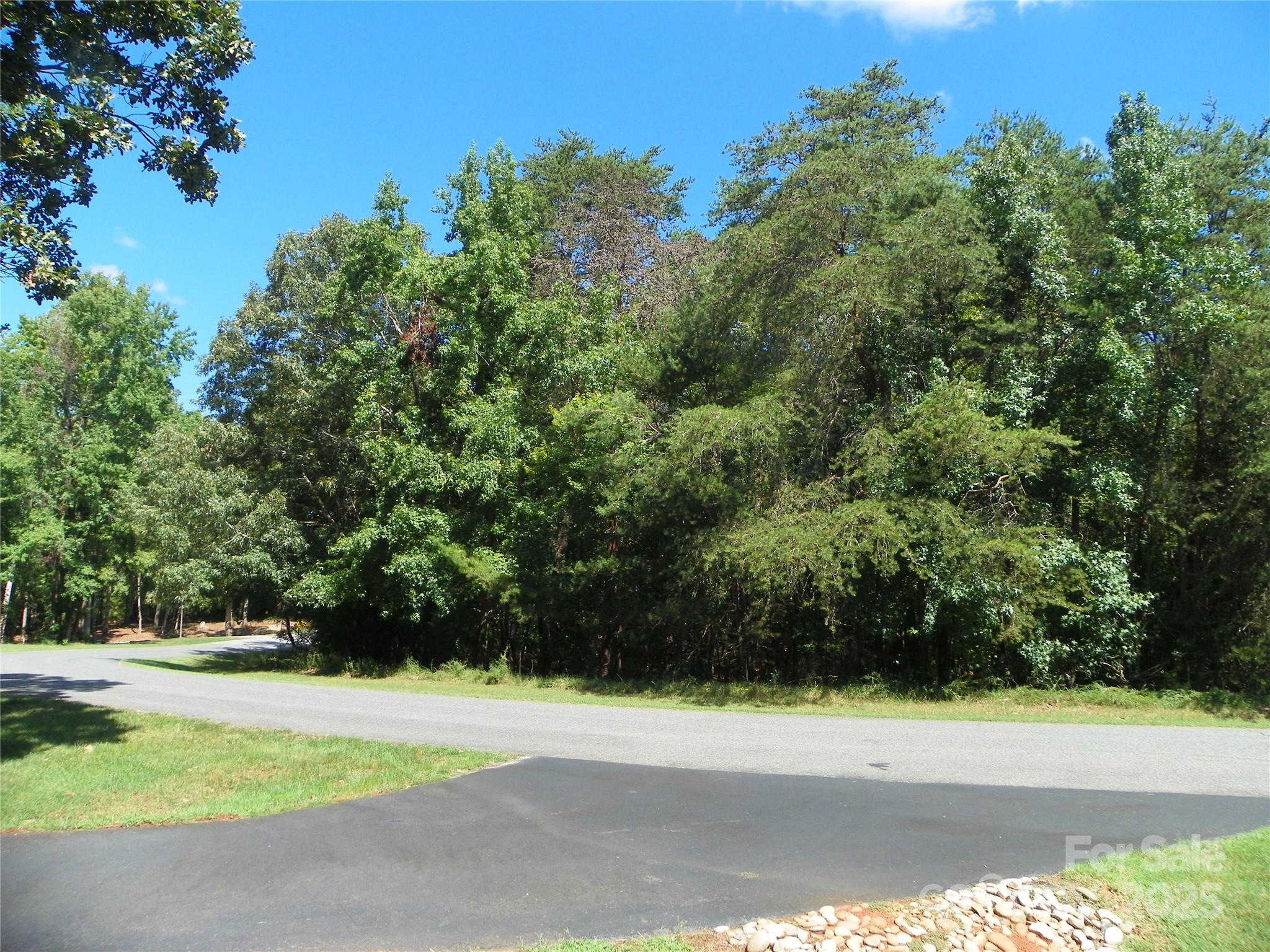 Come visit the  beautiful gated waterfront community of Heron Bay!!  Find out what LAKE life is all about! 
 This  3.70 ACRE building site gives room for that dream home and much more.  Enjoy making new friends at the community get togethers, play pickle ball across the street from the beautiful clubhouse- reserve it for personal functions, take strolls along the many walking trails, for your convenience a boat storage area ( for a small fee).
Beautiful lantern lit streets, a community boat launch for your use.  Just   1 hr. drive to major airports- Charlotte and Greensboro,  AND for the  hiking enthusiast Uwharrie National Forest is just minuets away!!  This site is priced to sell!! (Davis-Lot 40 PH 10)
SELLER SAYS "MAKE AN OFFER"!!