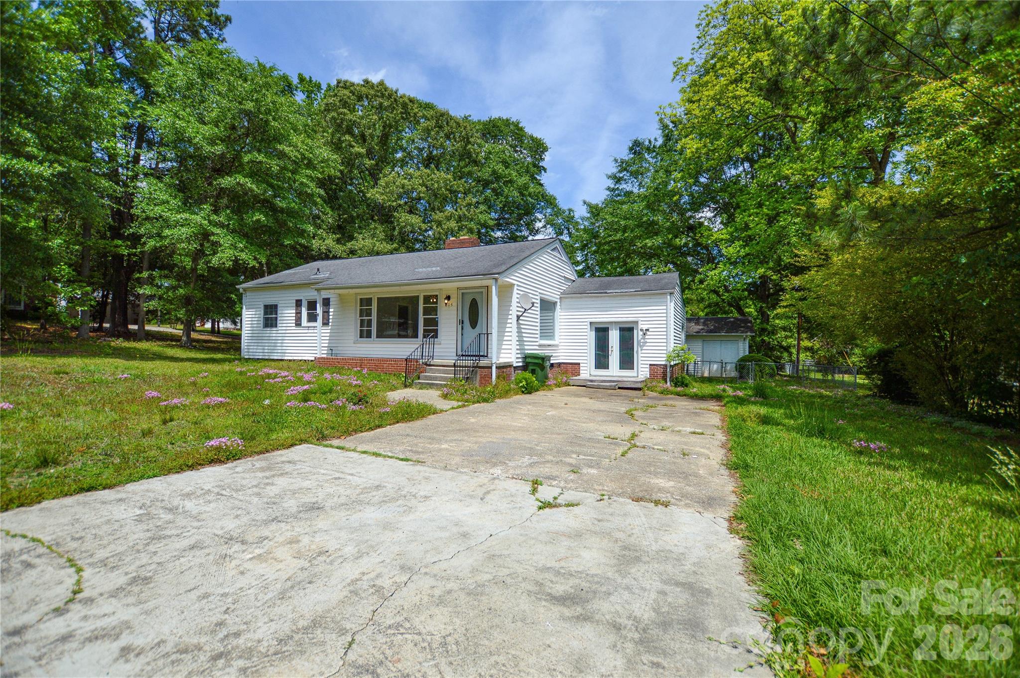 Location, Location, Location! and investor/investment opportunity
Perfectly situated just off the Hwy 9 Bypass in Lancaster, this charming home puts everything within easy reach — restaurants, shopping, the hospital, and the beautiful Lindsey Pettus Greenway. Whether you enjoy walking your dog or a stroll, the greenway entrance is just a block away.
This 2-bedroom, 1-bathroom home also features a spacious office/den that was created through a garage conversion, offering flexible living space with endless possibilities.
Inside, you will find a welcoming kitchen and dining area.  The electric fireplace insert conveys with the home.
Outside, the property truly shines. A detached 12' x 44' structure makes the perfect man cave, workshop, or hobby space, and a covered sitting area in the backyard is ready for your chairs, a swing, or whatever relaxation looks like for you in this large flat yard.
