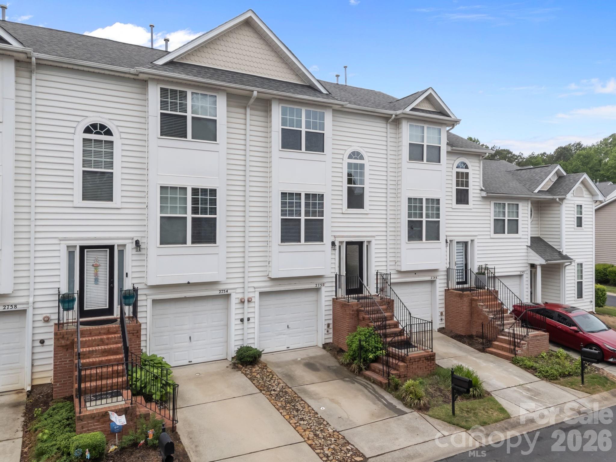 Welcome Home! Located in the desirable Mallard Creek area and one of the ONLY communities that offers a "Gated entrance "for both privacy and security. Complete with it's own community pool and clubhouse. Residents also enjoy direct access to Theresa Elder Park, providing convenient outdoor recreation just steps from home. Ideally situated, this townhome has quick access to Uptown Charlotte (see the city from pics). Inside, the home has been thoughtfully renovated with upgrades including brand new kitchen cabinets and granite countertops, new LVP flooring in kitchen, baths and foyer, new carpet throughout the the rest, freshly painted too. The kitchen also has stainless steel appliances, new dishwasher, stove and microwave. The refrigerator will also remain. A new water heater adds additional peace of mind! The HOA includes city water and sewer as well as trash services. Upstairs has owners suite with double windows for natural sunlight, new ceiling fan, walk in closet and private bath with dual vanity and soaking garden tub. The 2nd bedroom is also a nice size with hall bath serving this bedroom. Driving in, there is a one car garage and entrance to this level leads into a hallway with laundry closet, with new luxury vinyl and new light! There is also a spacious room that has double glass doors to patio. This area may serve as great flex space-perfect for home office, gym, entertainment area, game room or whatever works for you! To top it off, there is also a transferable home warranty as well as a termite warranty for 1 year. Please come and take a look, looking forward to your visit!