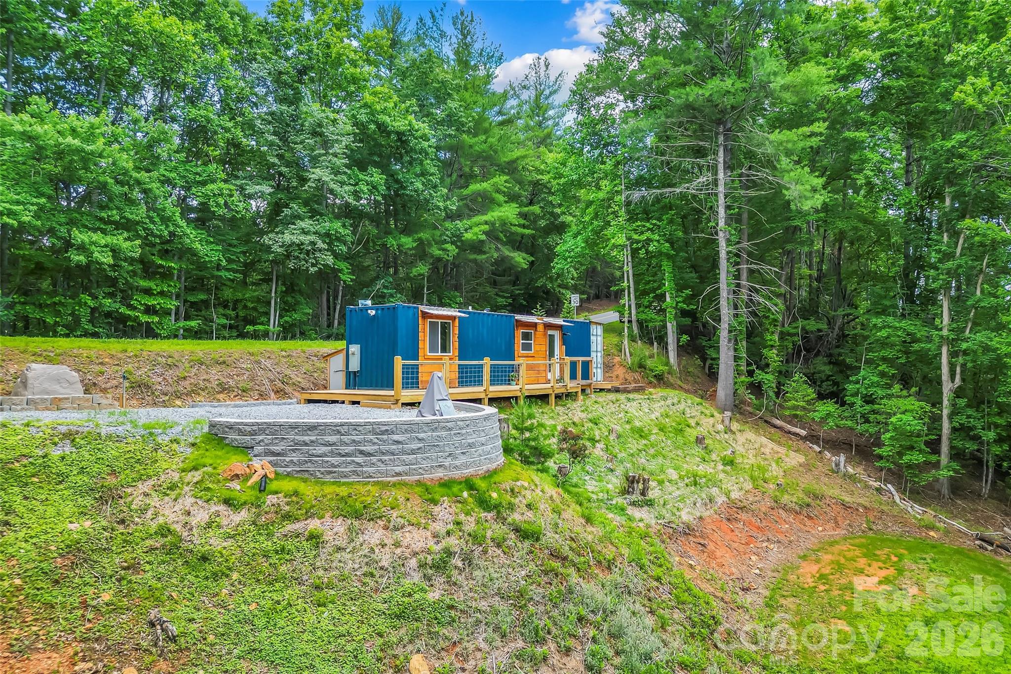 Unique container home setting with STR potential. Seasonal mountain views. Close proximity to Lake James. Ample space for weekend getaway or simple lifestyle. This container home packs just enough potential for easy escape in a private setting. 3BDRM septic and well installed. Dwelling was completed in 9/2025.
Hiking trails and creek.