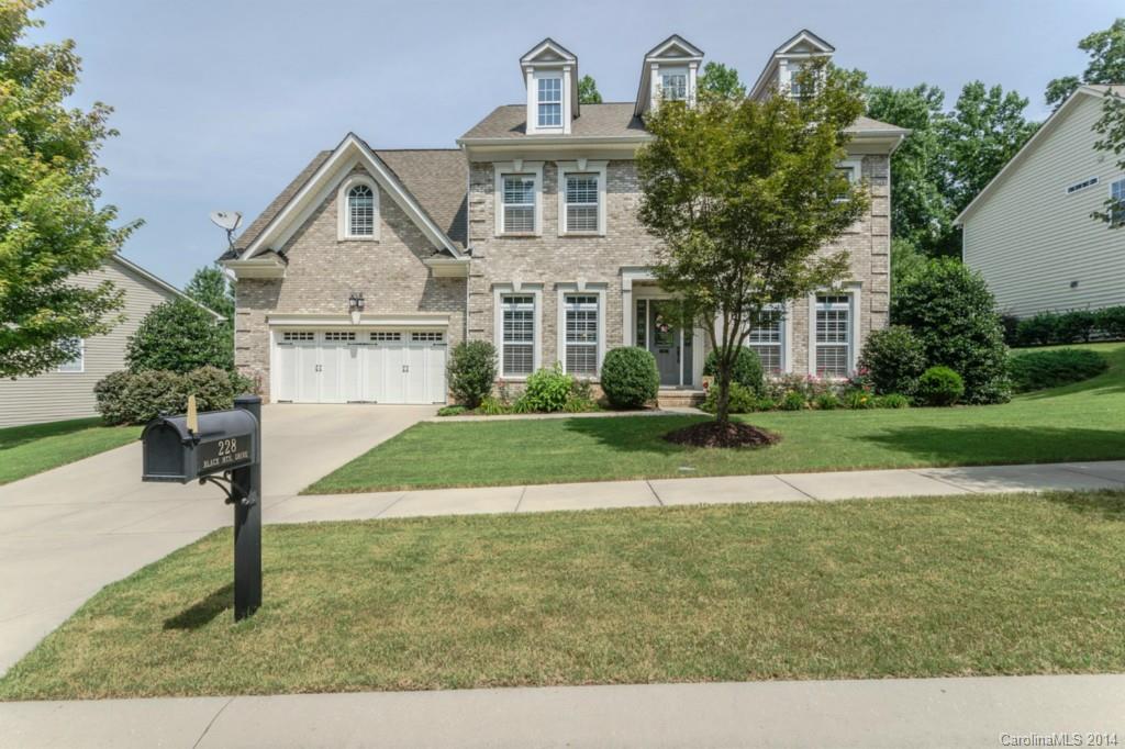 Stunning Classic BEAUTY with Amazing Indoor & Outdoor Living Spaces & private wooded back yard! Plantation shutters, hardwoods, surround, wainscoting... Study & Guest Suite on main. GOURMET Kitchen w/ SS Jenn Air appl., gas cooktop, double oven, granite, tile & more! Fabulous Screened Porch. Elegant Master Suite & Loft on upper level.  Lower level Rec Rm, 5th BD Suite PLUS versatile rooms. Beautiful Sunlit & shaded back yard areas, expansive Stone Paver Patio, lush fenced yard!  A MUST SEE!