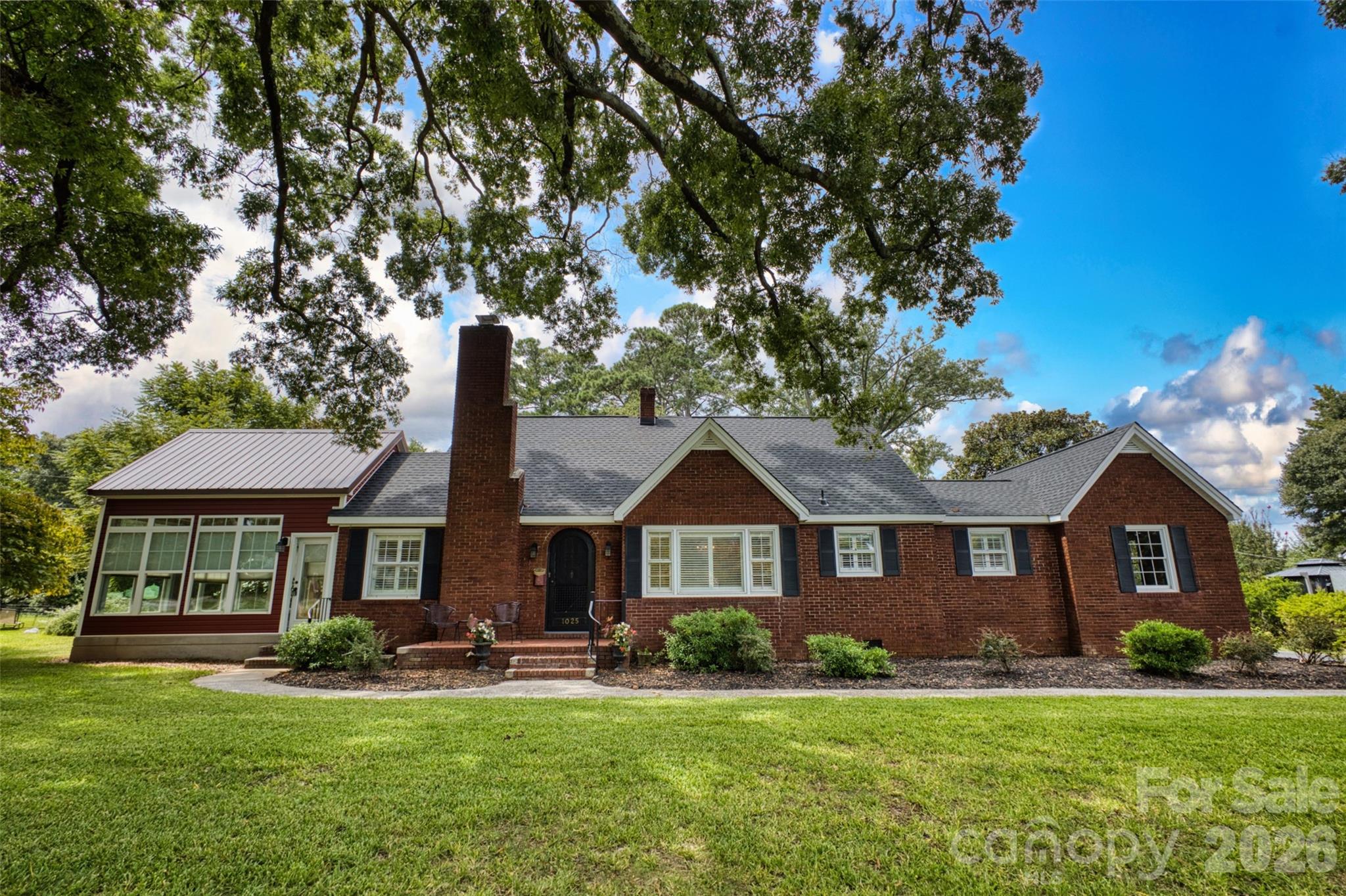 Charming All-Brick Home in Cherry Broad Acres with Pool & Sunroom. Welcome to this beautifully maintained and thoughtfully updated all-brick home, full of character and architectural appeal. Nestled in the highly sought-after neighborhood of Cherry Broad Acres, this spacious 3-bedroom, 2-bath residence blends timeless charm with modern comforts. From the moment you arrive, you’ll be captivated by the two massive oak trees gracing the front yard, setting the tone for the unique beauty that continues inside. The home boasts refinished hardwood floors throughout most of the living areas and a newly renovated, well-appointed kitchen. A highlight of the property is the stunning sunroom, featuring dramatic exposed wood beams reclaimed from Winthrop University—an awe-inspiring space perfect for relaxing or entertaining. The upstairs offers a versatile bonus area as well as the 3rd bedroom and 2nd bath, adding flexibility to the home’s layout. Step outside to enjoy your own backyard retreat: a beautifully shaped swimming pool with an attached spa, surrounded by a brick paver patio and complemented by a large, paved driveway. An attached 1-car garage and storage shed completes the property. This home has been lovingly cared for and offers a rare combination of charm, functionality, and neighborhood prestige. Don’t miss your opportunity to make it yours!