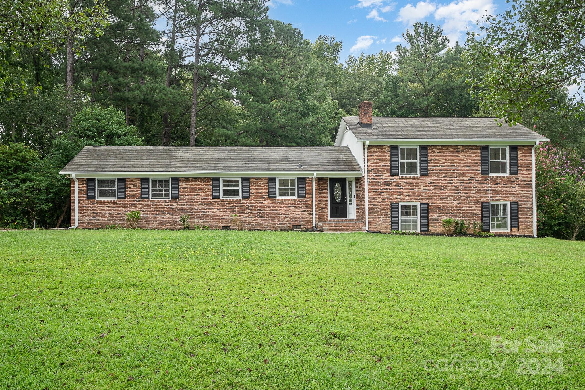 This stunning tri-level offers the best of both worlds: modern updates and classic character. This updated home features a full brick exterior, spacious bedrooms, and a large backyard with an inviting deck-perfect for outdoor living. With its prime location and numerous amenities, this home is a true gem. Beautifully maintained and move-in ready! ***Recent updates include crawlspace repairs, fresh paint throughout, new flooring, landscaping, updated bathrooms, kitchen cabinets refreshed, electric repairs, deck repairs, and roof tune up.***