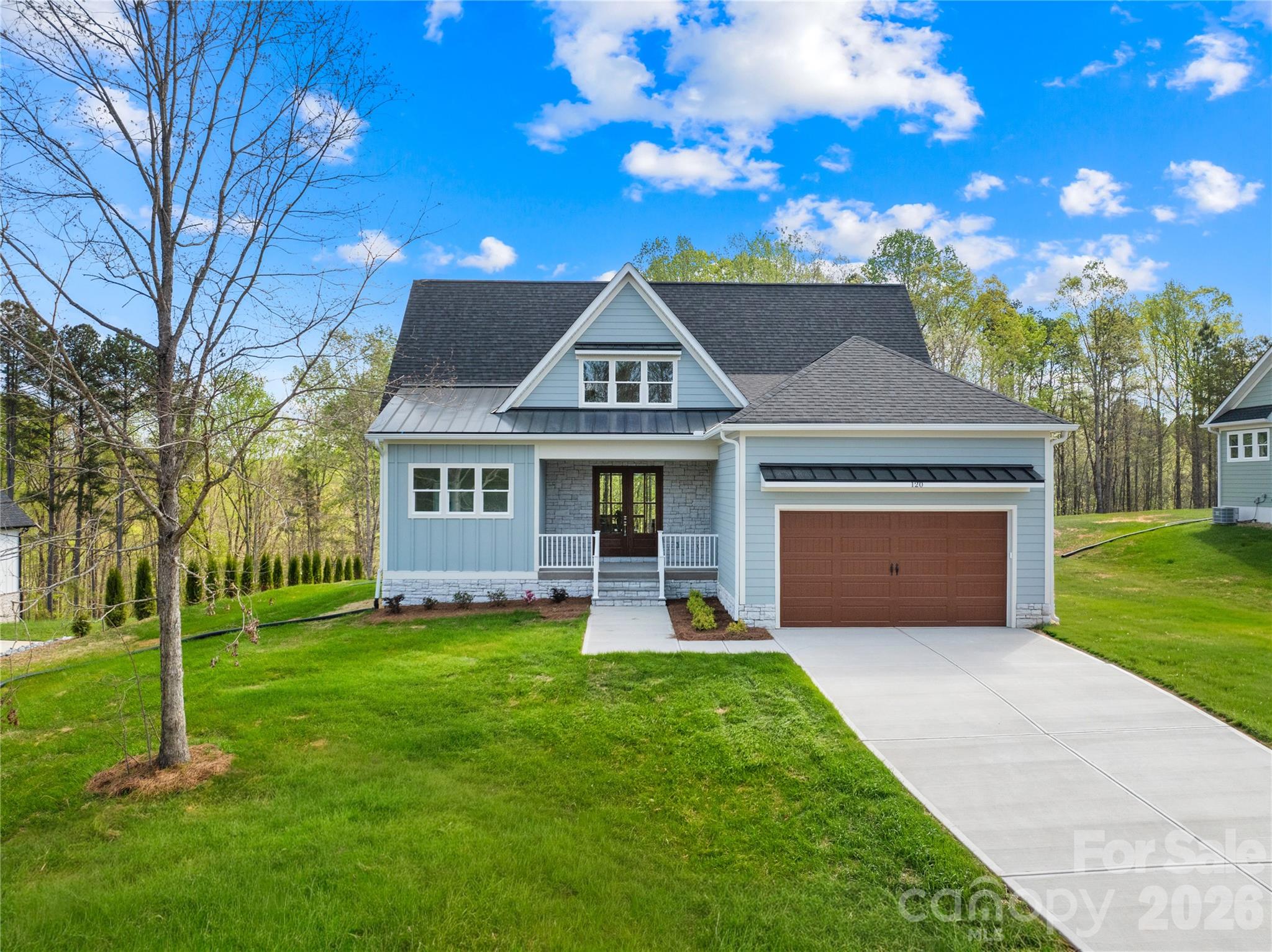 Motivated Seller! Bring us an offer! Tucked inside the quiet, gated community of River Oaks Landings along the Catawba River, with private access that carries you straight out to Lake Norman, this newly built home was designed with both intention and livability in mind.

The kitchen immediately stands out as the centerpiece, with granite countertops, a large island, abundant cabinetry, a 6-burner gas range, custom vent hood, and a separate scullery with a pantry that keeps everything organized and out of sight. It flows naturally into the living room, where a shiplap gas fireplace adds warmth and oversized sliding glass doors open to the covered porch, extending the living space outdoors.

The primary suite is positioned on the main level and feels like a true retreat, complete with a soaking tub, floor-to-ceiling tiled shower, dual vanities, and a custom walk-in closet with built-ins. The main floor also includes a powder bath, and a well-designed mudroom off the garage with laundry and a utility sink. Upstairs, the layout continues to feel both functional and flexible, with two bedrooms, two full baths, and a loft. 

Wide-plank LVP flooring runs throughout, and ceiling fans have been thoughtfully placed in all the right rooms, from the main living areas to the covered patio, enhancing comfort year-round.

Every detail was considered in how this home lives day to day, blending clean design, practical spaces, and elevated finishes into something that feels both custom and easy.