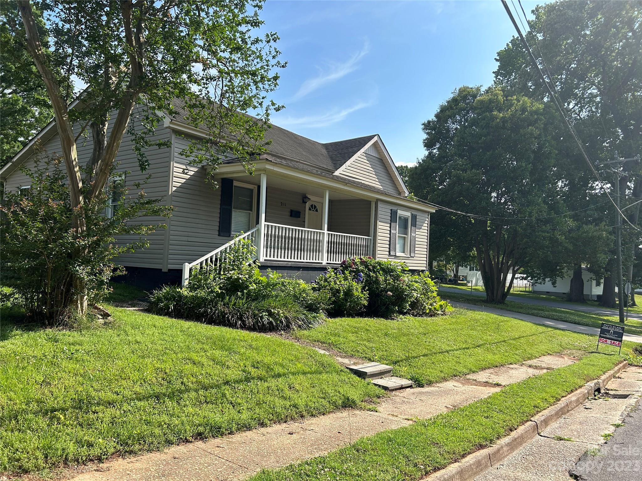 Amazing opportunity to own this corner lot, fenced backyard, home has 3 bedrooms and 2 baths. It has a wired workshop/shed and an additional shed. Close proximity to downtown, restaurants, Harris Street Park, Walter Elisha Park and Strawberry Festival, and much more.  Great schools! Home has had some renovations but could use some of your final touches!  Awesome location in downtown Fort Mill. Bring offers! Sellers believe 1224 square feet being measured.  Don't miss living in this ideal location.