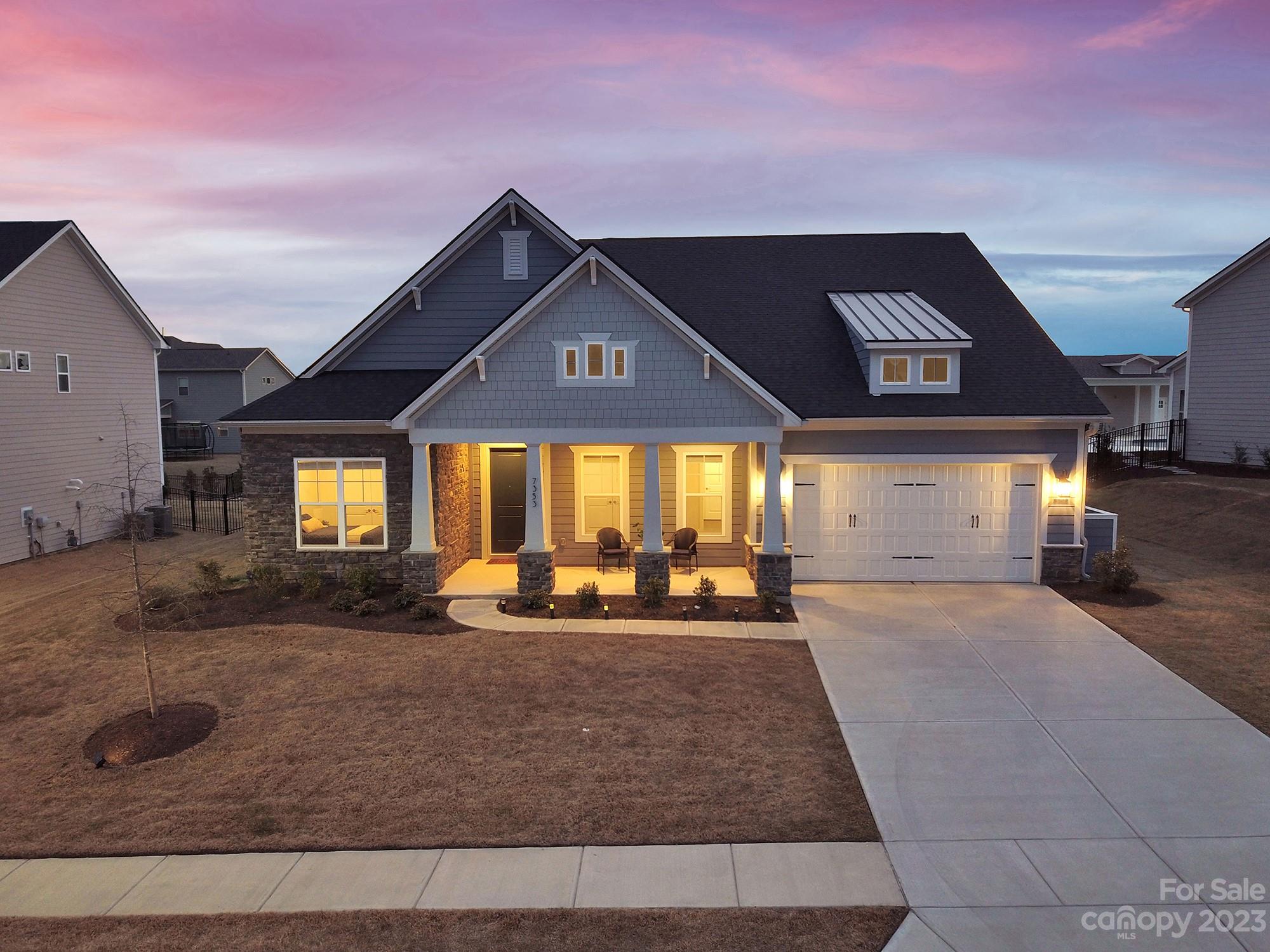 Better than new ranch home in sought after Bent Creek community in Indian Land! Resort-style pool and clubhouse with state-of-the-art fitness center and playground. The Davenport model by Jones Homes, features high ceilings, an open floor plan, dining room, large living room, and a huge chef's kitchen with large quartz top center island, gourmet cabinets, gas range, wall oven, stainless steel appliances, pantry, and oversized breakfast nook. The large owner's retreat features a huge walk in closet, connected laundry room w/ sink, & spa like ensuite bathroom with dual vanities and an extra large tiled shower. Three additional bedrooms share access to two full baths.Many upgrades including heat blocking blinds, Kitchenaid appliances. Enjoy outdoor entertaining in the fenced in backyard with 10k worth of privacy trees already planted for you. Plumbing and gas connection already set up for your outdoor kitchen if you want to add one.Still in builder's warranty.