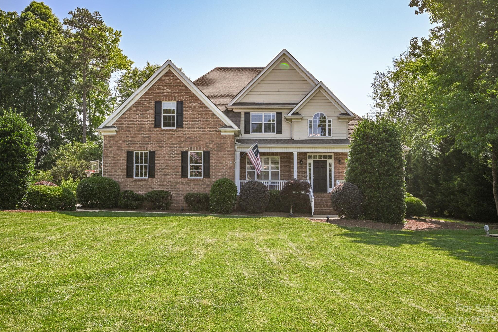 Quality matters. Fantastic 4 bedroom, 3 bath brick home located on a large 0.6 acre lot w/ more space than one could hope for. This well-appointed home boasts a spacious owner's retreat on the main level along with a guest room also on the main. The owner's retreat has large bath w/ cathedral ceilings, double vanities, tile shower & soaking tub. The gourmet kitchen is a cook's dream with double ovens, gas cooktop & ample cabinet space. Bathed in natural light, the main floor has a large dining room, a living room w/ vaulted ceilings & a fireplace w/stone surround. Wide plank wood flooring on the majority of the 1st floor, w/ tile in the bathrooms & carpet in the bedrooms. All bedrooms & baths are quite spacious. You will absolutely love the outdoor living space at this home, outfitted with a custom pool, outdoor kitchen, fireplace and covered porched perfect for entertaining. Don't miss the extra one car garage that is currently used as living space. Welcome Home!