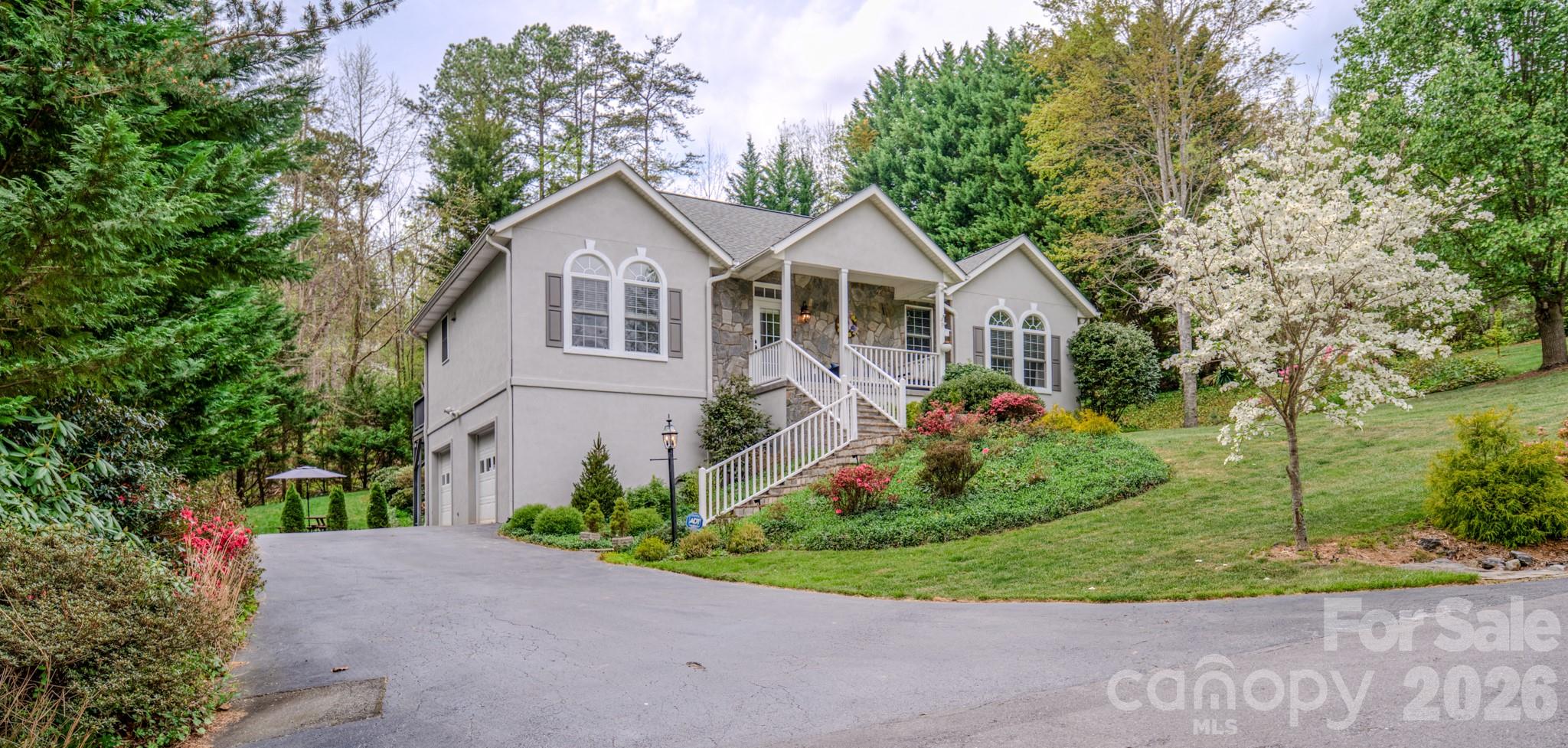 If you're looking for a well-established neighborhood, with seldom turnover and no short-term rentals, come see 9 Double Eagle Drive! Set against the scenic backdrop of Reems Creek Valley, this elegant residence offers a front-row seat to the Reems Creek Golf Club lifestyle in the highly sought-after Fairway View Estates. Tucked at the end of a quiet no-outlet street, this property offers exceptional privacy and a beautifully landscaped yard filled with mature trees, shrubs, and vibrant seasonal foliage. The finished basement adds exceptional versatility, offering a bedroom, a full bathroom, a large laundry room, a second gas log fireplace, and abundant closet storage—ideal for guests, recreation, or multi-generational living! Kitchen has a gas stovetop and beverage refrigerator, and a small fridge in the basement. Owners just resurfaced the driveway on 5/9/2026. Both primary and downstairs bathrooms were renovated in 2025. New HVAC, new roof, water heater all replaced in 2022. New Washer and Dryer in 2025 and new fridge in 2024.

Check out Reems Creek Golf Course and all it has to offer!  https://www.reemscreekgolf.com/
https://www.youtube.com/watch?v=Lz5fnqo7-rM