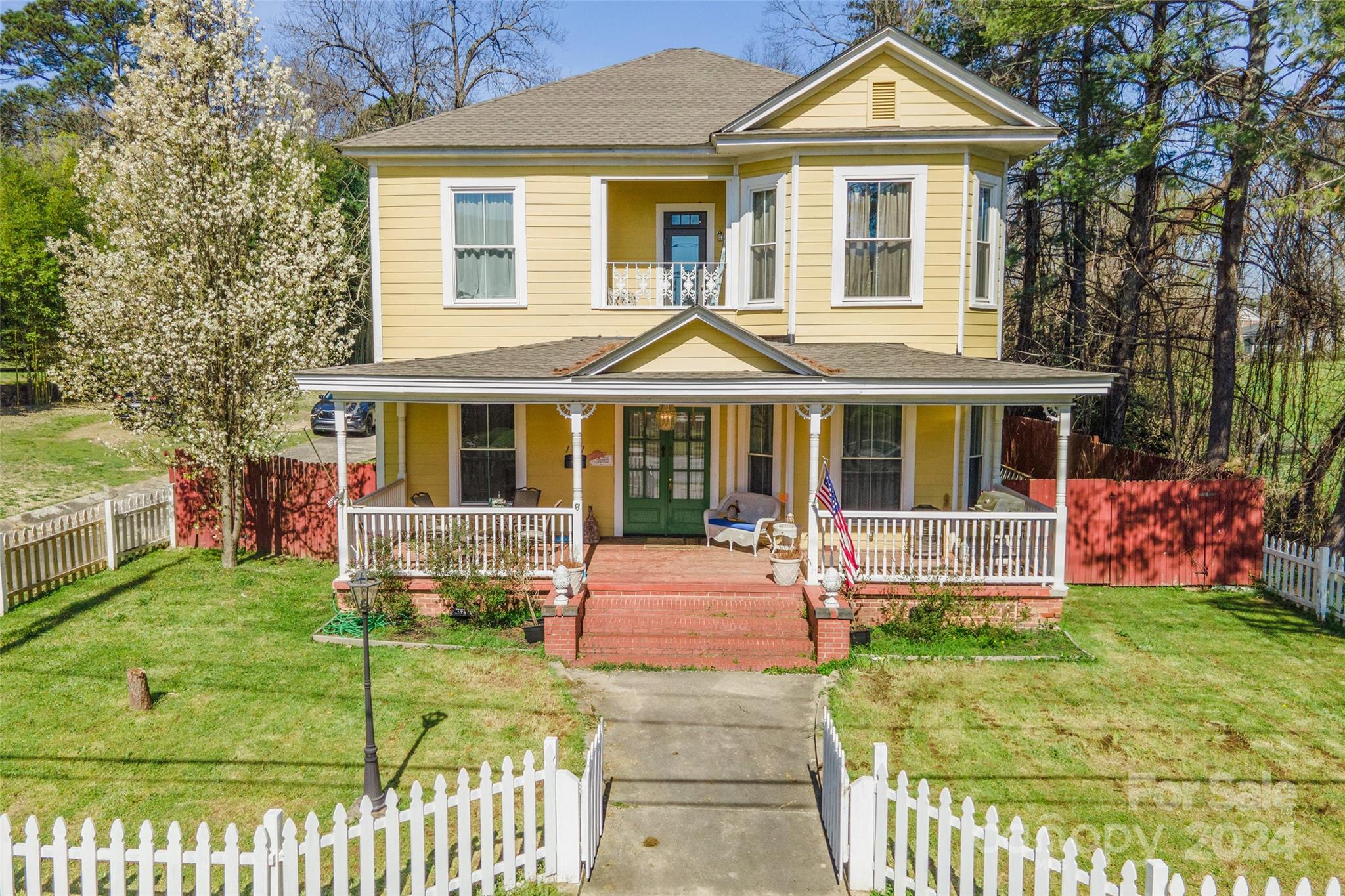 Find original beauty and impeccable details in this well maintained downtown Chester 2-story from 1892. Outside there is a detached one car garage, a concrete patio and large yard, and a large rocking chair front porch. The upstairs primary suite comes with a sitting area and an outdoor balcony on the front of the house. Plenty of bedrooms, storage space, and updated bathrooms. Complete with detailed moldings, original hardwood floors, and antique doors. There is also a bedroom downstairs with an ensuite bathroom that could be used as an additional primary. This home is perfect for someone who appreciates the small architectural details in an older house! Seller will provide a carpet allowance with an acceptable offer.