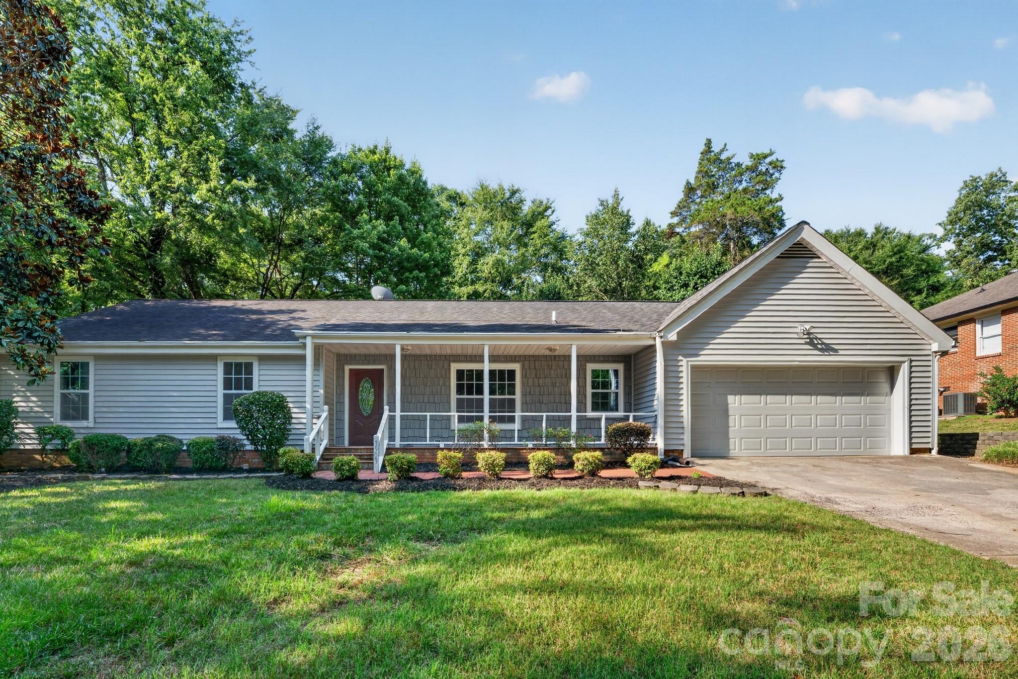 This well-maintained 3-bedroom, 2.5-bath South Charlotte home has been thoughtfully refreshed throughout and is ready for its next chapter, presenting a clean, inviting exterior. Inside, fresh paint in a warm neutral palette, new carpet in the bedrooms, and updated bathrooms with refreshed cabinetry, new fixtures, and framed mirrors give the home a bright, modern feel, while the rear living room's updated fireplace surround and adjoining sunroom create an inviting space to relax or entertain. Conveniently located near Ballantyne, Carmel Road shopping and dining, top-rated schools, and easy highway access in one of Charlotte's most desirable corridors.