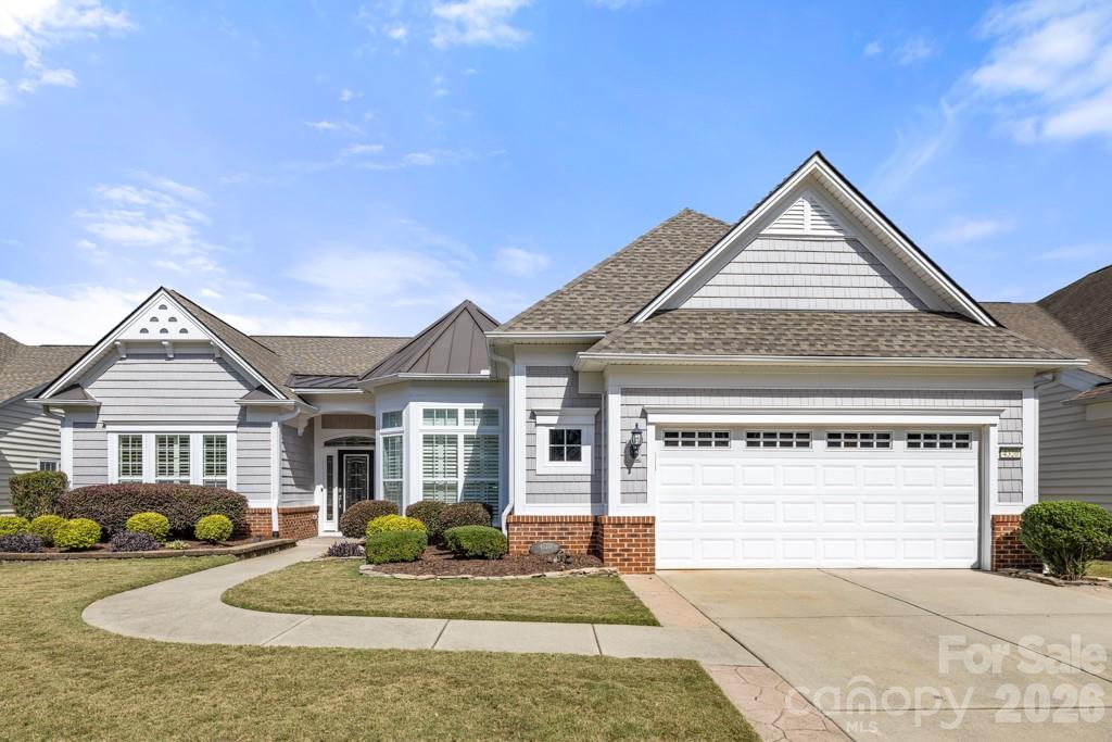 Welcome to this light-filled, 3-bedroom, 2.5-bath Cumberland Hall located in the highly sought-after, resort-style community of Sun City Carolina Lakes. Thoughtfully updated, this home features luxury vinyl plank flooring, plantation shutters, high-end ceiling fans, custom built-in cabinetry, abundant recessed lighting, and elegant crown molding and wainscoting, creating a refined yet comfortable atmosphere throughout.

The upgraded kitchen is designed for both everyday living and entertaining, offering white cabinetry, quartz countertops, a tile backsplash, and stainless steel appliances. It flows seamlessly into the dining area and great room, where a gas fireplace with a custom mantle invites you to relax and unwind.

The spacious primary suite includes a tray ceiling and a spa-like bath with dual vanities, a frameless tile shower with rain showerhead, and grab bars for added comfort & safety. A bright, airy sunroom provides the perfect spot for morning coffee or a peaceful retreat.

Additional highlights include a laundry room with additional cabinetry and an extra-wide garage complete with epoxy flooring, and a hydraulic attic lift. Step outside to the paver patio and fenced backyard with lush landscaping and a retractable awning, ideal for year-round relaxation or entertaining.The front yard also features in-ground irrigation.

Major updates include an upsized HVAC (2017), new roof (2023), new water heater (2025), and new dishwasher (2026), offering true move-in-ready peace of mind.Enjoy resort-style living with access to public golf, pools, tennis, pickleball, fitness centers, walking trails, kayak launch, a dog park, woodworking, and countless clubs and social activities. Don’t miss the opportunity to own this thoughtfully upgraded home in one of the Carolinas’ premier 55+ communities.