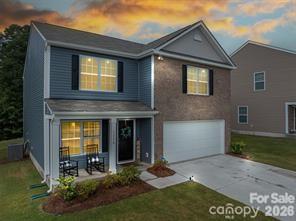 HUGE BUYER FINANCIAL INCENTIVES being offered on this almost new home that offers modern style, everyday comfort, and an unbeatable location! Situated in a sought-after community with a clubhouse and resort-style pool, this home is also one of only a few in the neighborhood that backs to the woods, providing added privacy and a peaceful setting. The beautifully appointed kitchen features granite countertops, a stylish tile backsplash, lots of crisp white cabinetry, and a spacious pantry. The open-concept layout flows seamlessly from the dining area into the inviting family room with a cozy fireplace, making it perfect for entertaining or relaxing. Conveniently located just minutes from I-85, Hwy 321, and Charlotte Douglas International Airport, you'll enjoy easy access to everything you need. 
SPECIAL FINANCING OPPORTUNITY! Qualified buyers may receive up to $17,500 toward their down payment, closing costs, and/or interest rate buy-down through grant programs offered by our preferred lender. This is free money that DOES NOT have to be repaid. If the buyer does not qualify for the grant programs, the seller will contribute up to $5,000 toward a buyer's closing costs or interest rate buy-down, with a full-price offer. These opportunities could make home ownership possible on a beautiful, spacious, like-new home.