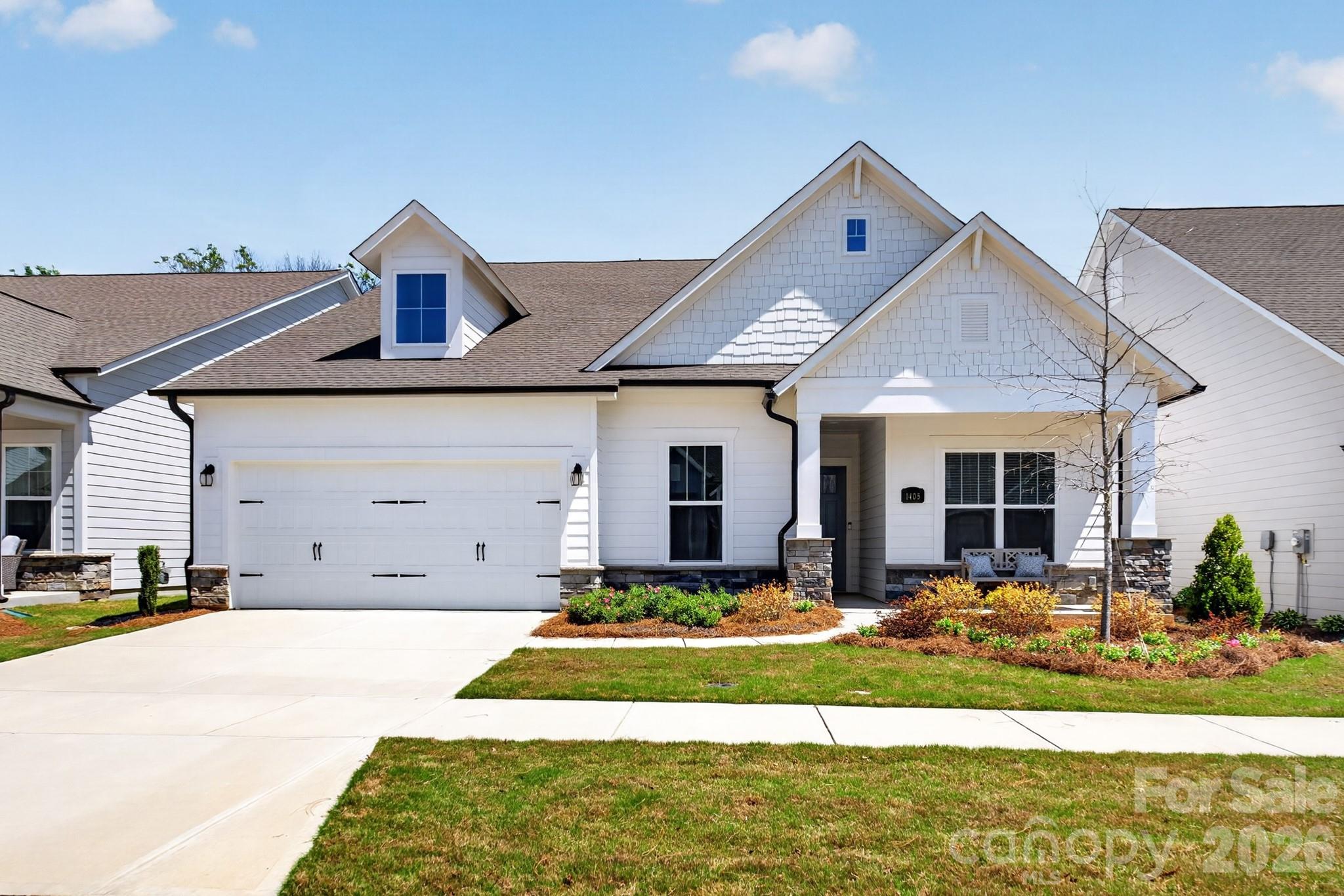 Get ready to fall in love with this gorgeous 1 story Ranch Style home in the award winning 55+ Community Encore at Streamside. This home is the perfect mix of comfort and style. With 3 spacious bedrooms, 3 full bathrooms, and almost 2400 square feet of living space, there's plenty of room to spread out and enjoy life.The heart of the home is an open, airy layout that's made for entertaining. Whether you're hosting a big gathering or just hanging out with family and friends, this home feels so welcoming and bright. You'll love the natural light! Step outside to the rear covered porch, and get ready to be wowed! It’s absolutely phenomenal — a true outdoor living space where you can relax or dine while overlooking the beautiful woods behind you. This beautiful home is located in the highly desirable area of Waxhaw with easy access to shopping and recreational amenities. With its modern design, high-quality finishes, and desirable features, this home is a must-see.