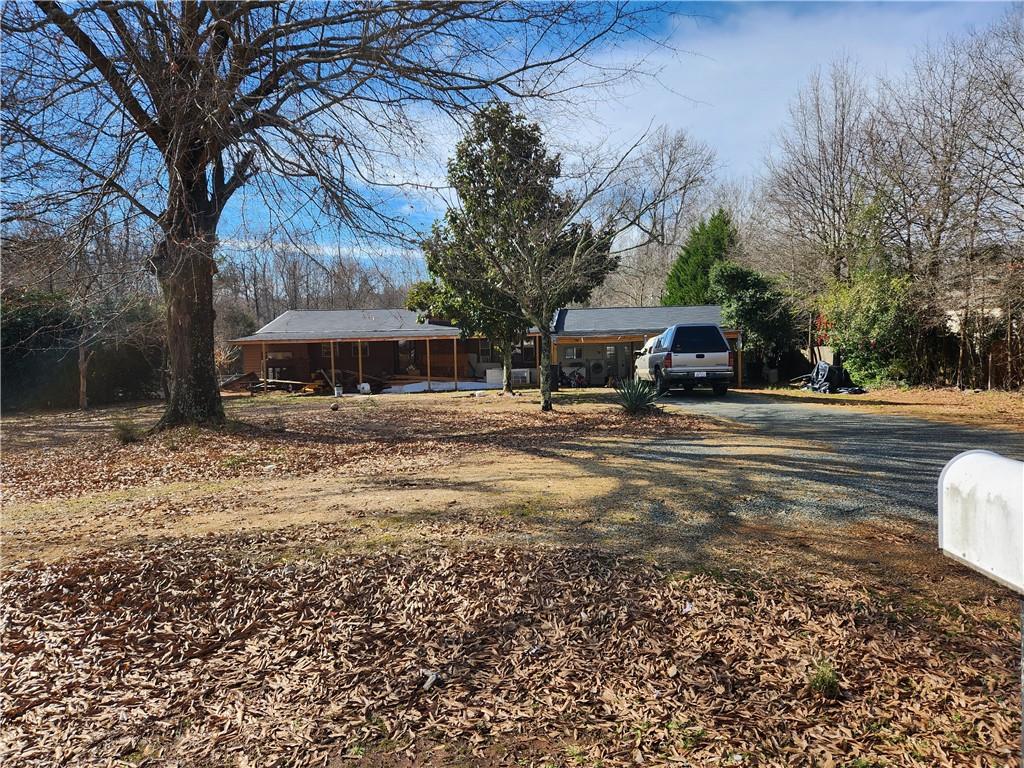 Rare find in Charlottee, 2 Acre Lot.  3 bed 1 bath home, needs some additional work to be completed.  Large flat lot with large outbuilding in back yard. Motivated Seller BRING ALL OFFERS. Just awaiting new owner to add finishing touches to the home.