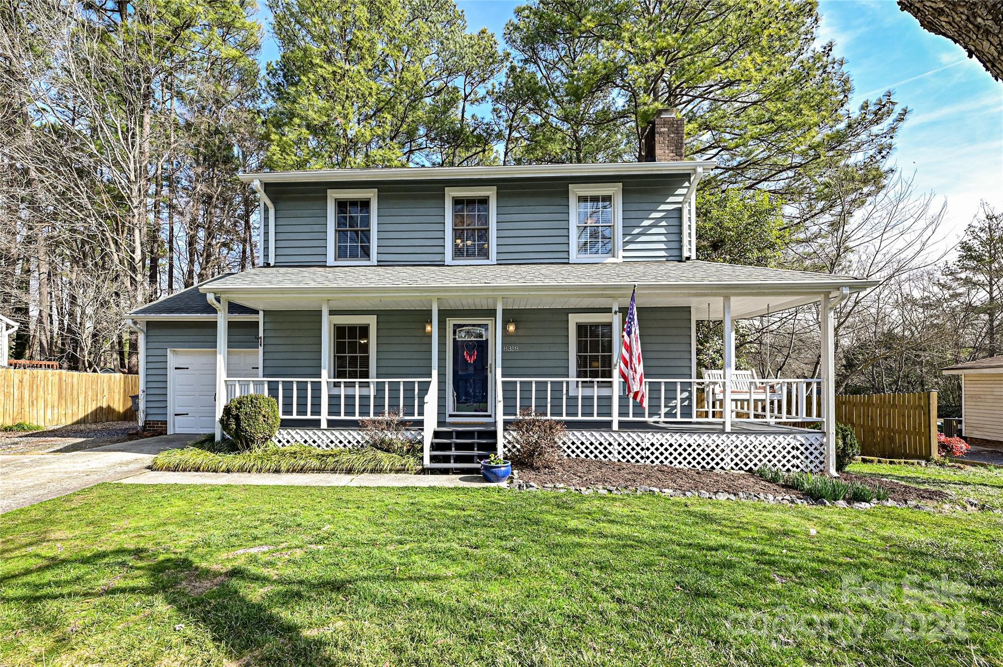 Beautiful two-story home w/quiet neighborhood appeal, just minutes to I-485 & Carolina Place Mall! Step off the picturesque, covered porch into the living room w/ true hardwood flooring & wood fireplace w/stone accent. The kitchen connects to the dedicated dining room w/crown molding. Upstairs, the primary bedroom boasts a private ensuite bath while two generous secondary bedrooms share access to a full hall bath. Relax on the two-tiered deck overlooking the expansive fenced in backyard w/shade trees & fire pit. The attached one car garage maximizes storage & functionality w/built-in shelving along the walls & above the parking area. Access the McAlpine Creek Greenway from the neighborhood or take a short drive to enjoy the shops, restaurants and entertainment in Ballantyne, SouthPark, Carmel Commons or downtown Pineville. With easy access to I-485, easily get to the Whitewater Center, Airport, Waverly, Matthews and so much more.
