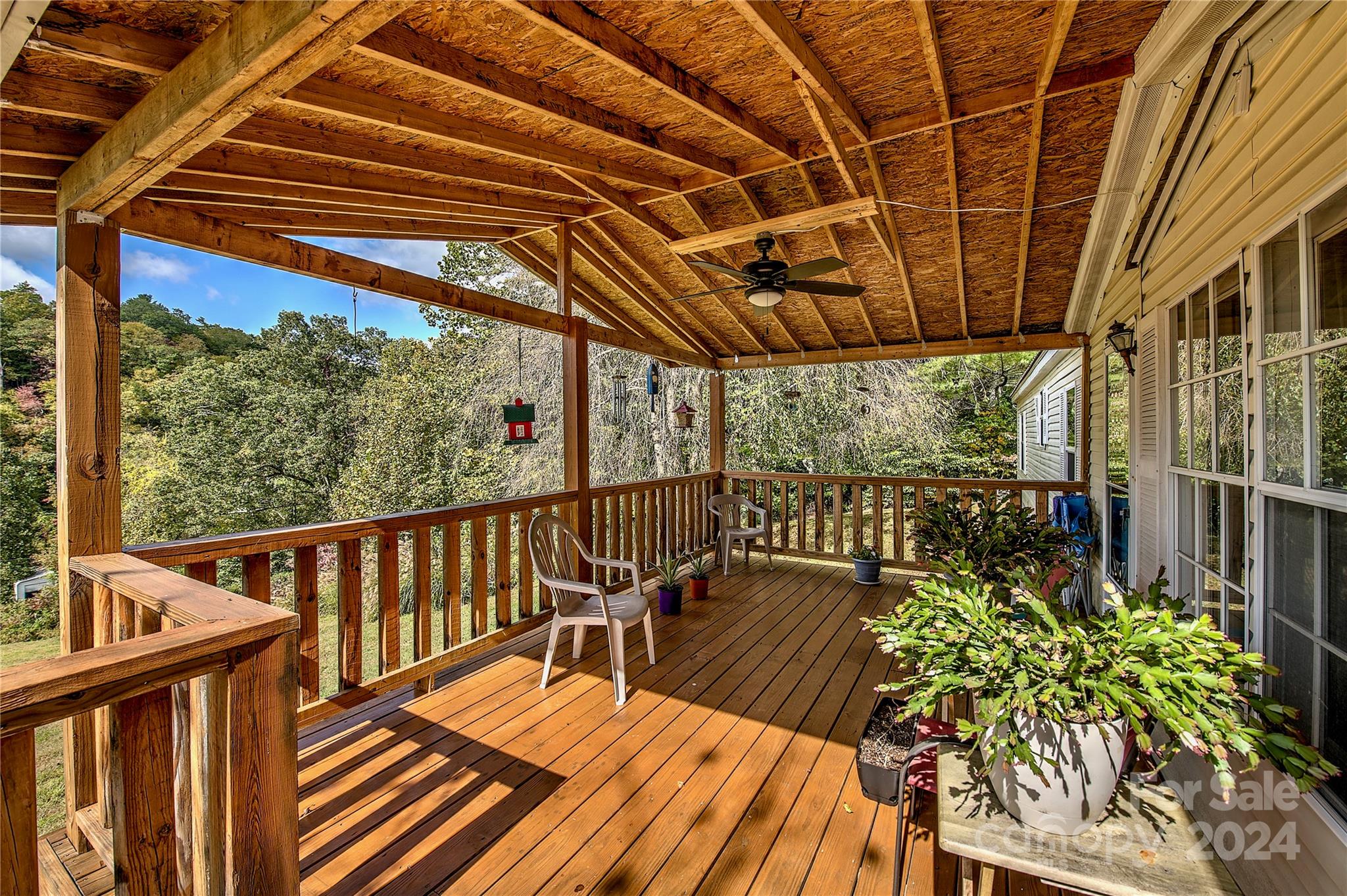 Private home, just outside the city limits with views, comfort & plenty of room! Privacy without remoteness & convenience without the crowd. 1 mile from regional hospital. This excellently maintained 4BD/2BA home on 1.62 acres features an open living style & spacious KT w/ well appointed cabinetry, island, central DN area, LV room w/ gas log fireplace, large GR for plenty of family & friends, large guest BDs, master BD features walk-in closet, duel vanities, walk-in shower, garden tub, laundry/mud room on the main, & a grand wooden covered deck presenting the magnum opus for summertime entertainment, easy & gradual steps at rear covered entry. Permanent foundation, new HVAC, & metal roof (5yr.), new oil furnace w/ above ground TK. Furniture Optional. Plenty of parking, two utilities bldgs. & garden area. Your place in these mountains is calling your name. 1 min. to downtown & hospital, 15 min. to Burnsville, 30 min. to Lake James & I-40, 50 min. to Asheville, and 2 hrs from Charlotte.