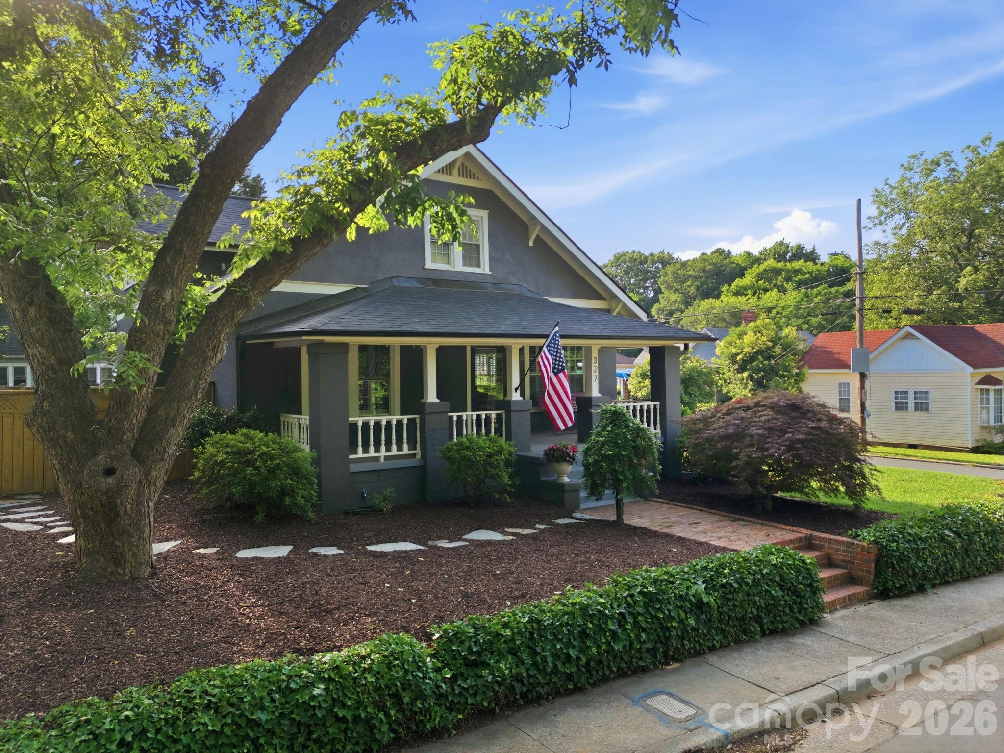 Absolutely stunning renovation in a prime Charlotte location! This beautifully reimagined home is MOVE-IN READY! It blends timeless character with high-end modern updates and exceptional craftsmanship throughout. Gorgeous hardwood floors, designer finishes, custom cabinetry, stylish lighting, and an open, inviting layout create a warm and sophisticated feel from the moment you enter. The original front door and fireplace preserve the home's character while complementing the thoughtful renovations. Kitchen features abundant cabinetry, quartz countertops, subway tile backsplash, stainless steel appliances, and plenty of workspace for cooking and entertaining. Solid-core doors on the main level add both quality and charm. Floor plan offers two primary suites, one on the main level and a second suite on the upper level providing exceptional flexibility and privacy. Spacious living areas are filled with natural light and offer the perfect balance of comfort and style. A finished lower-level flex space offers endless possibilities and is ideal for a media room, recreation room, home office, fitness area, hobby space, or additional living and entertaining area. Outside, enjoy a spectacular beautifully landscaped yard that creates a wonderful setting for relaxing or entertaining. Thoughtfully updated throughout with attention to every detail, this home is truly move-in ready. Conveniently located within walking distance of the light rail and near Uptown Charlotte, major highways, dining, shopping, entertainment, and everyday conveniences. A rare opportunity to own a beautifully renovated home where quality craftsmanship and thoughtful design shine in every room.  Close proximity to Five Points Park which offers walking trails, pickle ball courts and open spaces. The entrance to the park is about 1/2 block down the road.  The house is 1 block (3 minute walk) from the French Station Gold Line train stop. The house is a three minute bike ride to the Stewart Creek Greenway or 10 minute walk. You can walk or bike on the Stewart Creek Greenway directly to uptown or the steps of the Panthers Stadium. The property has updated yard irrigation and a connection for a natural gas fire pit or grill in the back yard. Welcome Home!
