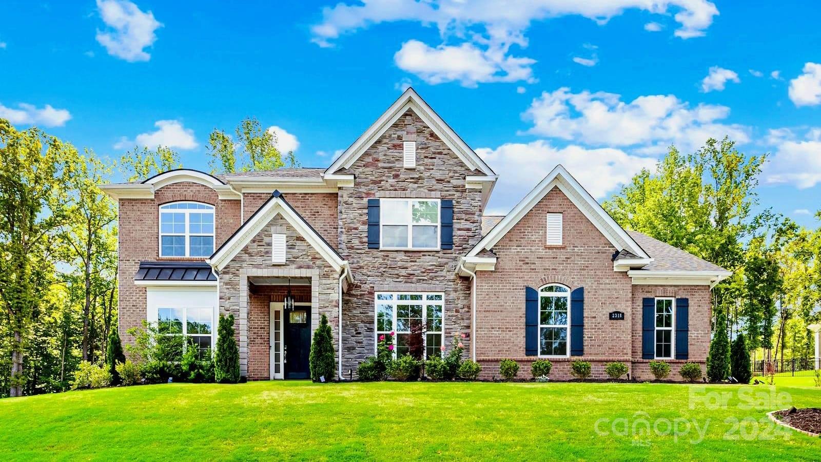 Discover luxury living in Bretagne's highly coveted estates enclave. This PRIVATE, GATED community is located minutes from the new Ballantyne Bowl and amphitheater, shopping, and restaurants. This 2022 build features 4 beds, 4.5 baths, including a spacious main-floor primary suite with your dream bathroom and massive walk in closet. Each bedroom has an en suite bath and walk-in closet. A grand entryway with 22 foot vaulted ceilings leads to the spacious living area.  The gourmet chef's kitchen features double-stacked cabinets, a butlers pantry, walk in pantry, double oven, gas range, and stainless steel appliances.  Additional main-level amenities include an office, formal dining room, and a 3-car garage. Upstairs, a loft and large bonus room provide versatile spaces for relaxation and entertainment. Enjoy outdoor living on the screened-in patio, with 0.73 acre to create your dream backyard oasis. Bretagne offers resort-style living, complete with an incredible outdoor pool.