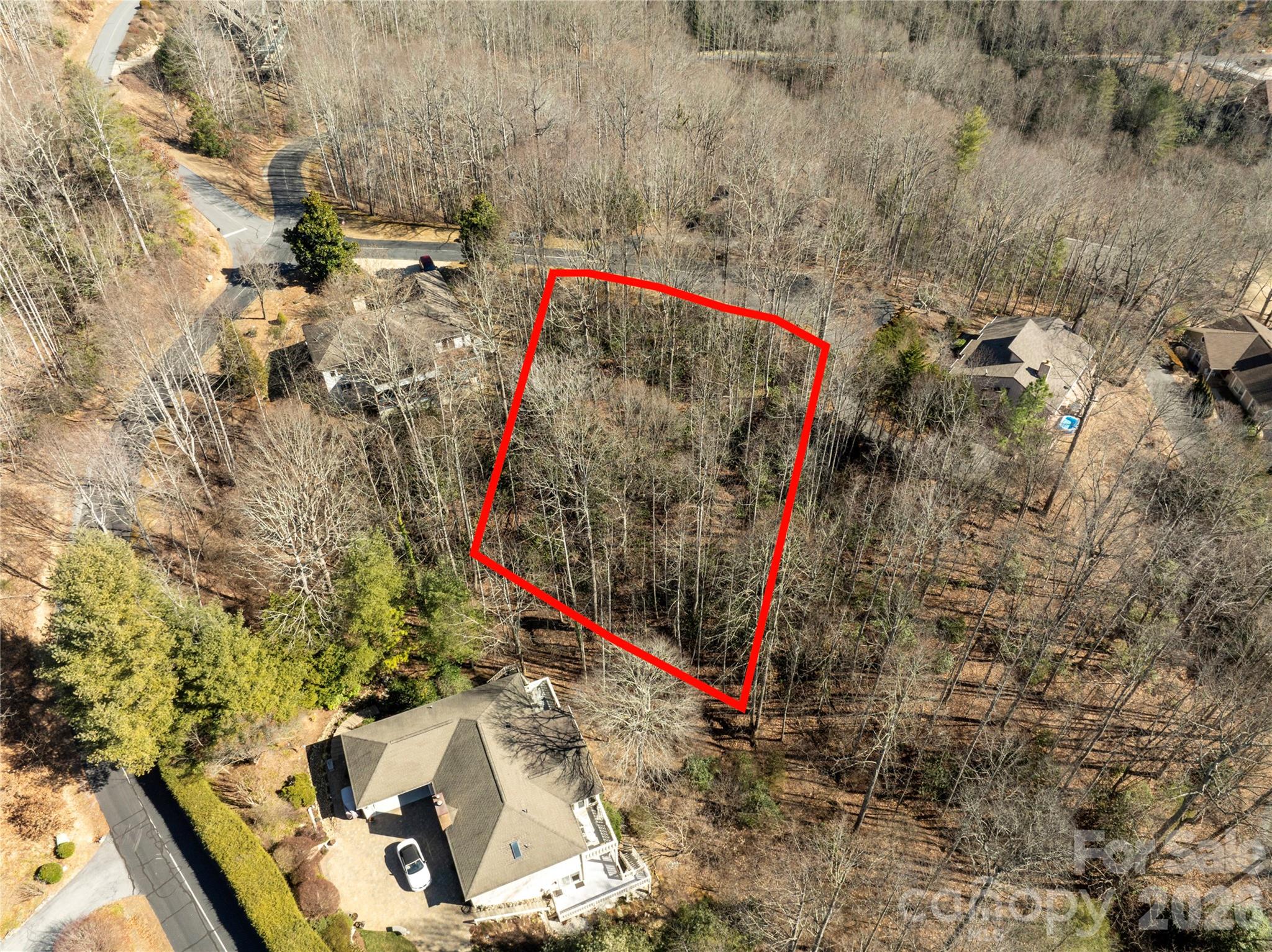 Discover the opportunity to build your mountain retreat in Cummings Cove, one of the area’s most scenic gated golf communities. Lot 16 in the Cove Woods section is tucked away on a quiet cul-de-sac, offering privacy, natural vegetation, and winter views with the potential for mountain views depending on home placement.  This homesite is well suited for a comfortable main-level living design, with space for a flat driveway, main-level garage, and walk-out lower level—an ideal layout for both full-time living or a lock-and-leave mountain getaway. Conveniently located just a short drive from the main gate, the property offers easy access while still enjoying a peaceful setting.  Life in Cummings Cove is about more than golf. The community offers membership options with amenities that include a pool, fitness center, tennis courts, pickleball, and an active social calendar. A popular community garden provides fresh produce and supports local food banks, reflecting the welcoming spirit of the neighborhood.  Whether you are planning a full-time residence or a seasonal mountain escape, Cummings Cove offers a relaxed lifestyle with opportunities to stay active and connected.