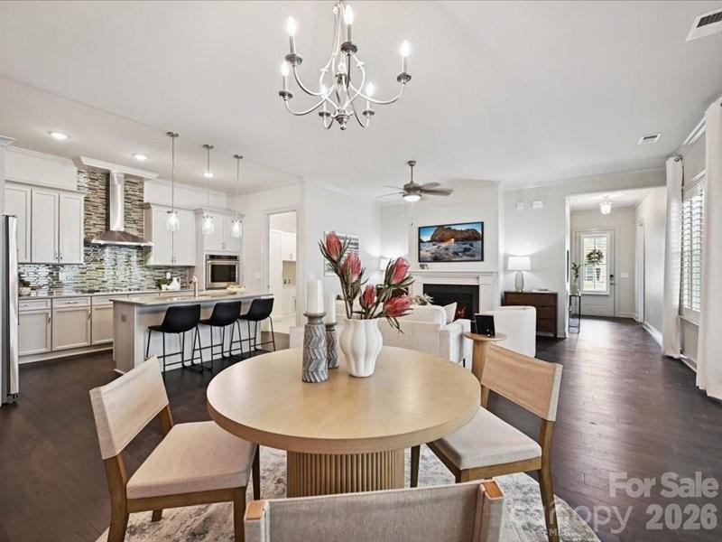 Convenient, luxury low-maintenance patio home in Walden Austin Village! This ranch plan has 3 bedrooms, 3 full baths with a 2 car garage- all on one level! Open floorplan is spacious and inviting. Gourmet kitchen with a large center island, cooktop, Kitchenaide wall oven and lots of cabinets. Primary suite features a zero-entry shower, dual vanities and a large walk-in closet with custom shelving. Plantation shutters for privacy. Lawn maintenance (outside of the fenced area) is included in HOA dues. House backs up to wooded common space. Community sits directly across from Austin Village shopping center, providing access to the grocery store, pharmacy, medical offices and restaurants all at your fingertips! Located just minutes to 485, Waverly and downtown Matthews!