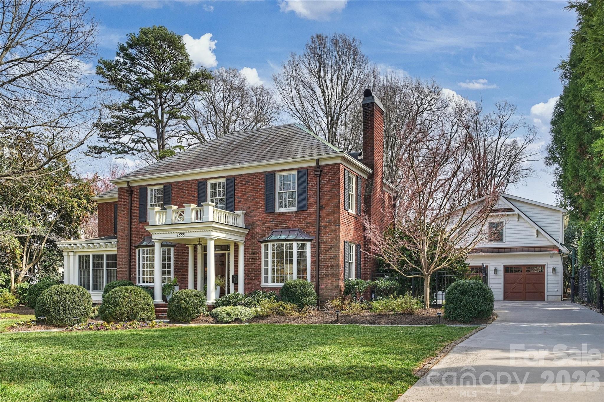 This stately, beautifully renovated residence on prestigious Queens Road West blends timeless
sophistication with modern comfort. Built in 1936 by the Heath family and cherished by only
two additional owners, 1555 Queens Road West reflects a rare legacy of care. A distinctive
fireplace dating to the late 1800s, relocated from a Central Avenue home, adds exceptional
character. A major 2003 expansion introduced the spacious breakfast room, kitchen and pantry,
inviting family room, primary suite, and office. The thoughtfully designed layout offers the
perfect balance of elegance and comfort—gracious formal living and dining rooms set the stage
for memorable entertaining, while the cozy den and impressive family room provide relaxed
spaces for everyday living. The chef-inspired, newly updated kitchen showcases stainless-steel
appliances, a stylish bar with wine cooler, and a generous central island that flows seamlessly
into a sunlit breakfast room. Upstairs, the private primary suite is set apart from three additional
bedrooms and includes a spa-like bath renovated in 2023 and dual organized closets. Added in
2020, the garage and versatile studio with full bath, beverage center, and Murphy bed complete
this exceptional property. The expansive, secluded backyard is beautifully landscaped with
vibrant greenery and mature trees, offering a serene retreat with plenty of room to add a
swimming pool.
