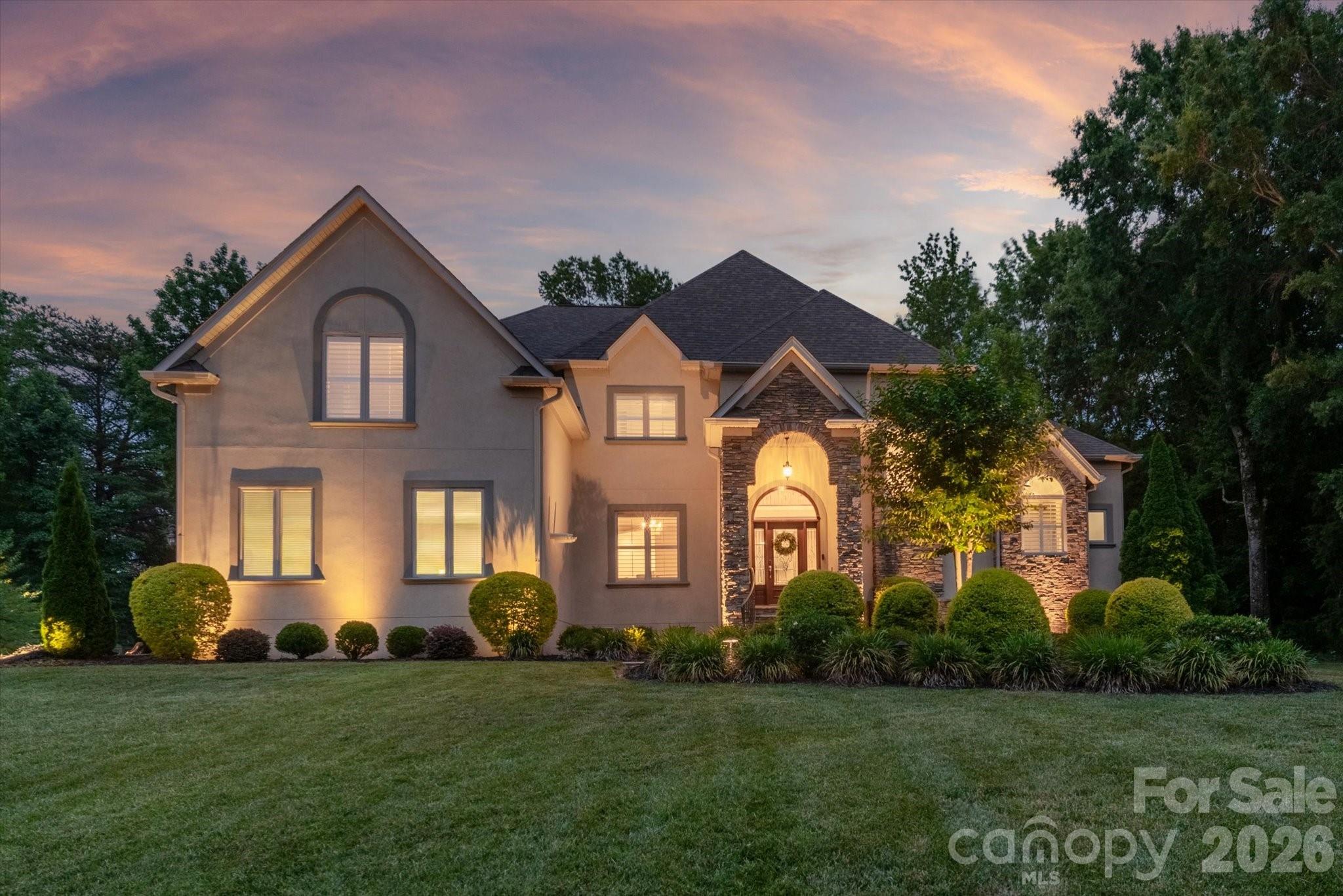 Experience Poolside Living and Elevated Comfort in the Heart of Fort Mill

Beautifully upgraded 4-bedroom, 4.5-bath home on a quiet cul-de-sac in Spring Branch, zoned for Catawba Ridge High School. Thoughtfully designed for comfort, flexibility, and entertaining, with an upstairs bonus room offering the potential for a fifth bedroom.

The main level provides an open layout with an oversized family room featuring a fireplace, built-in bar, beverage refrigerator, and double doors opening just steps from the pool. Plantation shutters, updated lighting, and abundant natural light create a warm, welcoming feel throughout the home. The kitchen, breakfast area, and keeping room are anchored by a stone fireplace and offer views of the pool. A small office off the kitchen serves perfectly as a workspace or household hub. The kitchen includes smart appliances. Smart thermostats and surround sound enhance everyday living and extend to the fenced pool deck.

The main-level primary suite offers a tray ceiling, new LVP flooring, and private access to a platform deck—an ideal spot for morning coffee or quiet relaxation. Upstairs, all bedrooms include en-suite baths. The upper level also features a laundry chute, large walk-in storage, and a second small office off one bedroom that can also function as a playroom or study space.

The backyard is designed for both relaxation and entertaining, featuring an in-ground pool, expansive patio, and outdoor fireplace. The pool and spa include app-controlled color-changing lighting, creating the perfect setting for evening gatherings. A dedicated exterior-access powder room adds convenience for pool guests.

Extensive updates include a new roof with gutter guards (2023), new plumbing piping (2024), main-level HVAC (2021), upper-level HVAC (2023), new appliances, new garage door openers, updated lighting and ceiling fans, and new Kohler toilets. A whole-home water softener and filtration system was added in 2024, and the crawl space includes a vapor barrier and dehumidifier.

Additional features include a side-load garage with epoxy flooring, irrigation system, front-yard uplighting, custom blacksmith-crafted front porch railings (2024), and a laundry room complete with a utility sink and pet spa.

Thoughtfully updated and designed for everyday living, this Spring Branch home offers exceptional indoor-outdoor spaces, flexible living areas, and easy access to shopping, dining, and everyday conveniences.