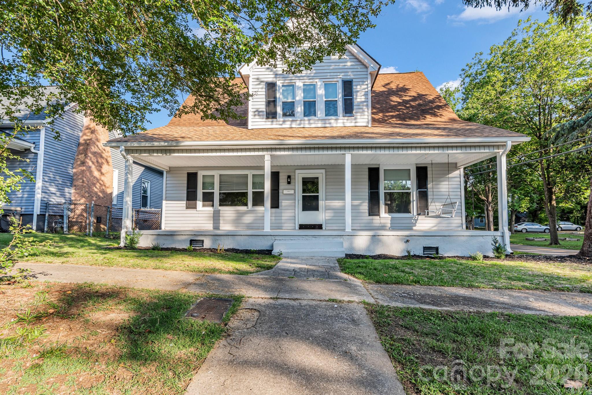 Welcome home to this beautifully renovated 1.5-story gem in the heart of Spencer! Offering over 2,000 square feet of living space on a corner lot, this spacious home blends modern updates with timeless charm.  The main level features a private primary suite, an expansive living room, a dining room and a bright, inviting kitchen complete with brand-new appliances—including the refrigerator—and a separate pantry for added storage. Upstairs, you'll find 3 additional bedrooms and a full bath, providing plenty of space for family, guests, or a home office. Recent updates include new LVP flooring throughout, new windows and fresh interior paint, making this home truly move-in ready. Start your mornings or unwind in the evenings on the welcoming front porch, the perfect spot to relax and enjoy the neighborhood.  Outside, you'll appreciate the partially fenced backyard, detached one-car garage, and convenient location just minutes from the new Spencer Town Park, the North Carolina Transportation Museum, local dining, shopping, and more.  Don't miss your opportunity to own this spacious home in one of Spencer's most convenient locations!  INQUIRE ABOUT SPECIAL FINANCING WITH LENDERS!
