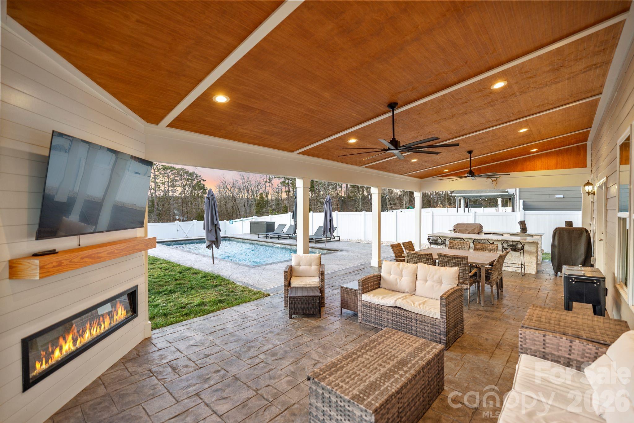 Welcome home to this stunning, thoughtfully upgraded residence in sought-after Cypress Point, where space, function, and resort-style outdoor living come together seamlessly. Offering 5 bedrooms, 4 full bathrooms, and an expansive upstairs bonus room, this home was designed to impress at every turn. The main level features a private home office, formal dining room, and a spacious family room with a cozy gas fireplace, all flowing effortlessly into the heart of the home—an impressive gourmet kitchen complete with granite countertops, double ovens, a walk-in pantry with custom shelving, and a whole-house water filtration system. A guest bedroom with a full bathroom, along with a conveniently located laundry room, completes the primary level—ideal for visitors or multigenerational living. Upstairs, you’ll find four additional bedrooms, including a luxurious primary suite with an oversized custom-shelved closet, and a large bonus room perfect for movie nights, a playroom, or a home gym.

Step outside and prepare to be wowed—the backyard is truly the star of the show. Designed for both entertaining and everyday enjoyment, it features a custom stamped concrete patio, a heated saltwater pool with tanning ledge and bubblers, and an incredible 36’ x 16’ covered patio with an electric heated fireplace. The outdoor kitchen is fully equipped with an oversized grill, refrigerator, and built-in kegerator, all set within a fully fenced backyard offering exceptional privacy. Located in a vibrant community with sidewalks throughout, residents enjoy access to an outdoor pool, picnic area, playground, and sport courts—making Cypress Point the perfect place to call home.