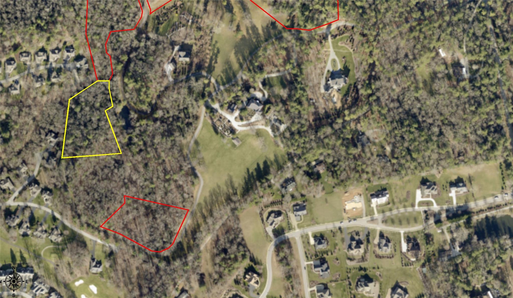 This 2.45+/- acres homesite features a near flat building site within the beautiful park like community of Sherwood.  This gated community is in the heart of Flat Rock and features high quality homes with a minimum size of 3,500 square feet.