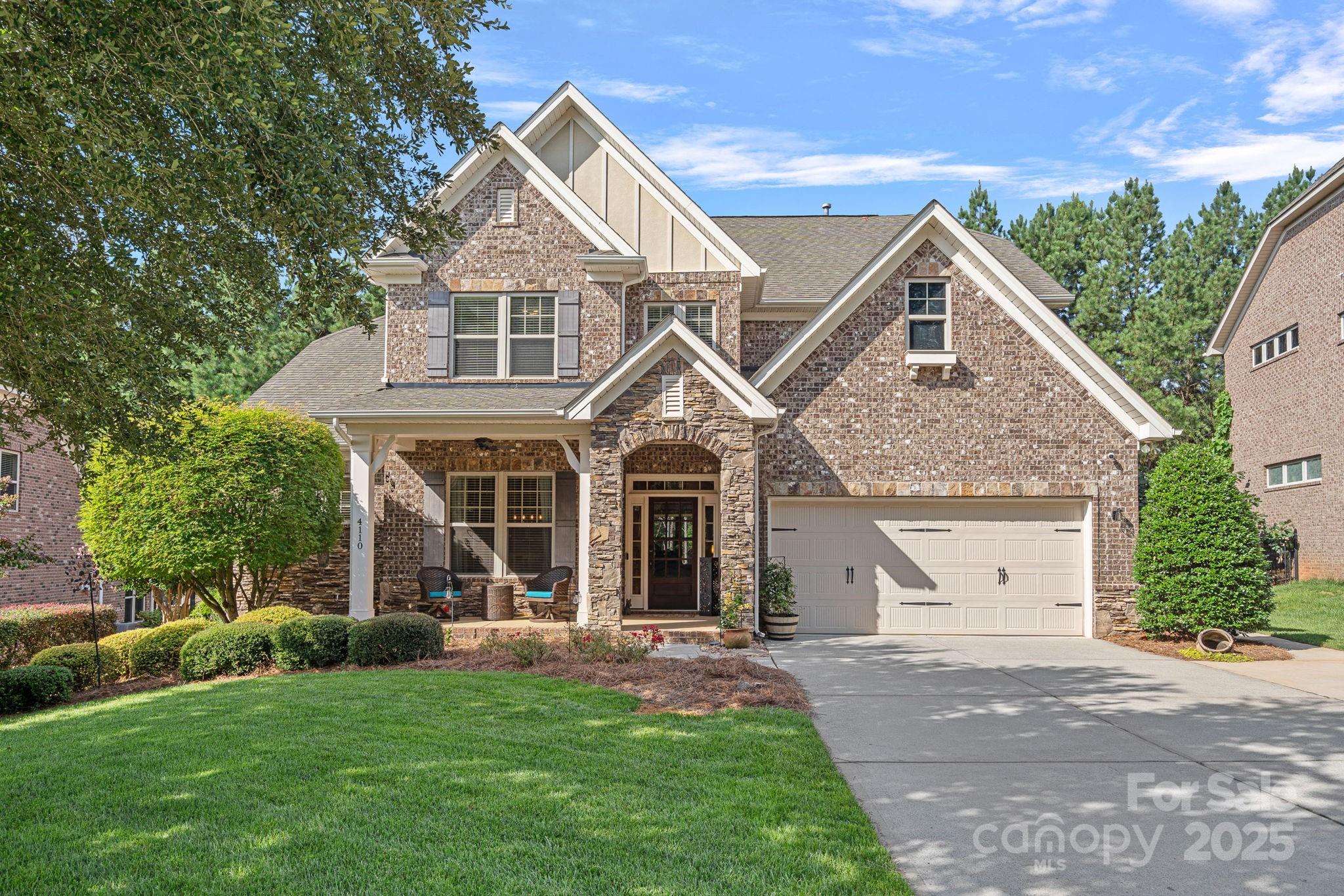 All-brick 2-story home in highly desirable Barber Rock! A versatile flex space/dining area welcomes you at the entry. Beyond the foyer, the great room impresses with a coffered ceiling, abundant natural light, and a beautiful stone fireplace. The gorgeous kitchen is the heart of the home, featuring an oversized island, ample counter space for entertaining, and a custom walk-in pantry. Just off the kitchen, you’ll find a convenient drop zone and laundry area to keep the home organized. The main-level primary suite offers a spa-like bath and a custom walk-in closet with thoughtful organization. Upstairs, you’ll find three spacious bedrooms, two full baths, and a large bonus room perfect for a media space, home office, playroom or 5th bedroom! Outdoor living shines in the fenced, private, tree-lined backyard with a fire pit—ideal for entertaining or quiet evenings under the stars. Barber Rock offers community amenities such as an outdoor pool, sidewalks, picnic area, fire pit, playground, and recreation area. Low SC taxes and conveniently located near Ballantyne, Fort Mill, top-rated schools, shopping, dining, and 485 for easy commuting.