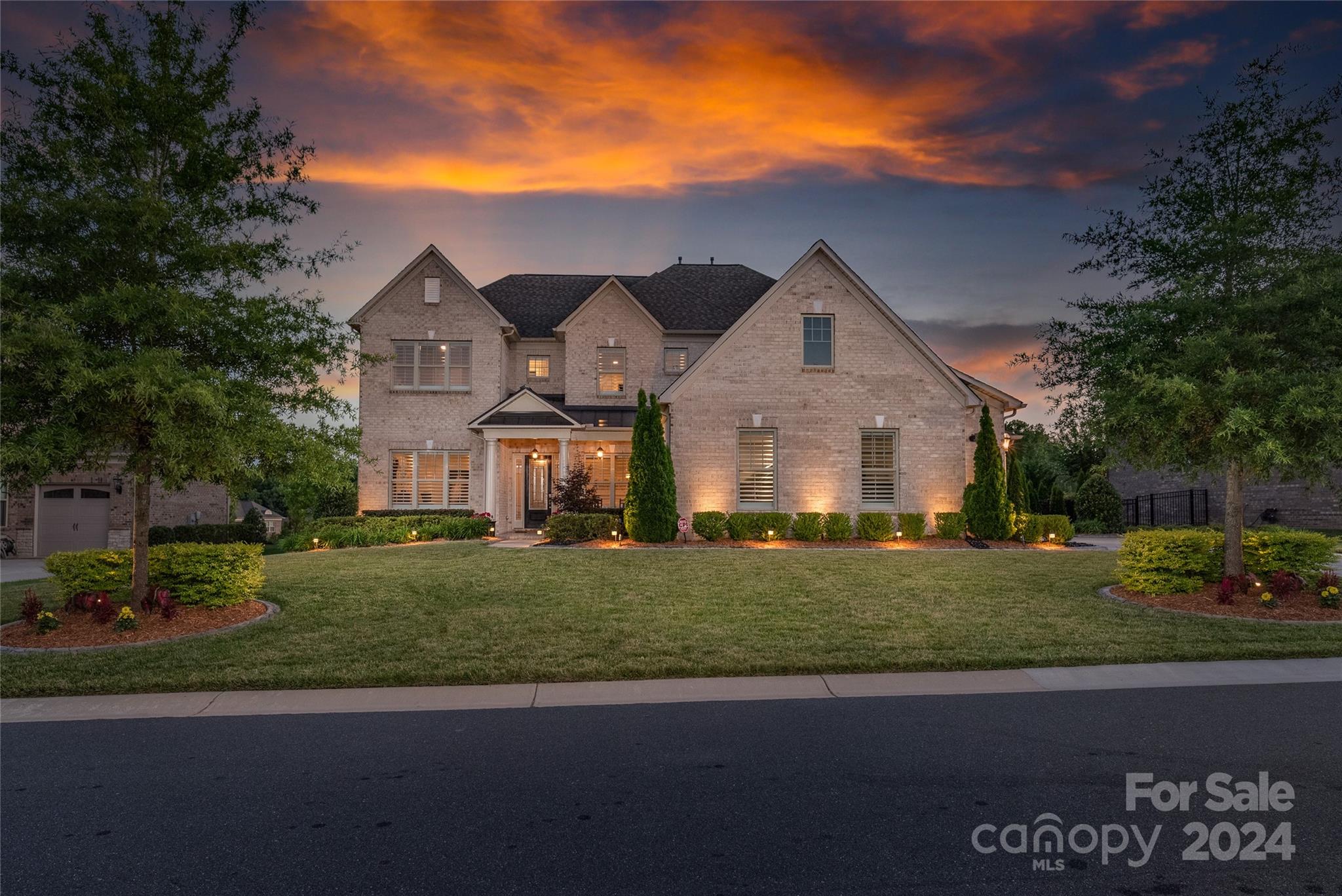 Don’t miss this stunning home and its gorgeous outdoor entertaining oasis! There's an array of beautiful features from extensive trim work to upgraded lighting fixtures to 5” wood floors. Main level has an open floorplan with a stunning kitchen, with a large island, gas cooktop, farm sink & large breakfast area. A coffered ceiling and stone fireplace create a cozy space in the Great Room. Formal dining room and office are located off the foyer. Upstairs you’ll find three additional bedrooms, a bonus/5th bedroom, media room & spacious loft. The saltwater pool has a sunbathing ledge and waterwall & is surrounded by beautiful travertine decking. Entertain on the covered porch or under the large pavilion with a grill station and speakers. The backyard is very private, surrounded by privacy trees and beautiful landscaping. Home has many smart features. Great storage. Bridgemill offers a range of great amenities including two pools, tennis and pickleball courts, playgrounds and more!