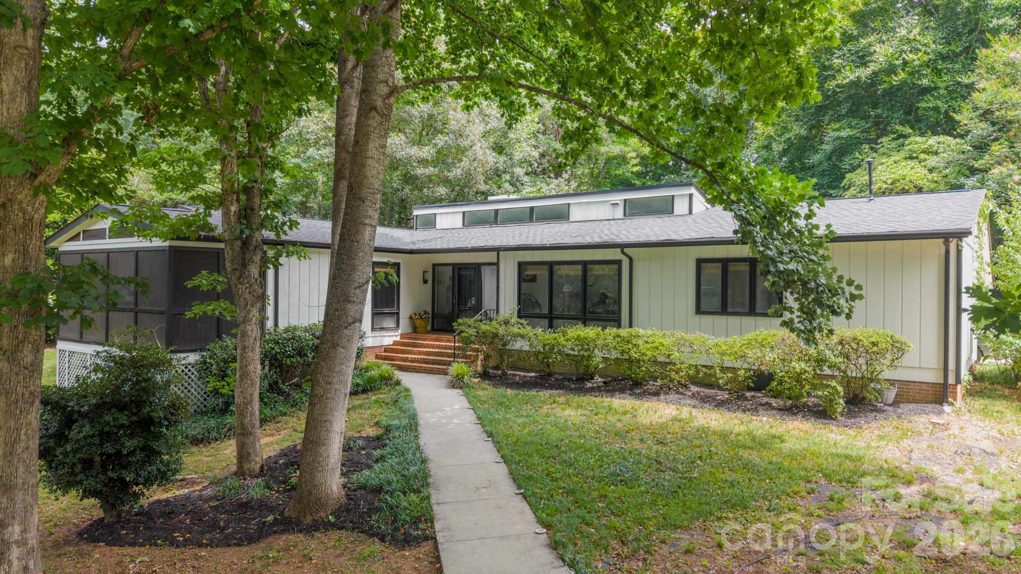 Welcome to your mid-century modern dream in the heart of Rock Hill! Tucked away on a quiet, tree-lined street, 322 Grady Drive offers the rare combination of timeless architectural character, thoughtful updates, and an incredible sense of retreat. From the moment you arrive, the home’s distinctive mid-century style is impossible to miss.

Inside, find stunning built-ins throughout the home that  add both beauty and function, while the striking mid-century fireplace serves as a true focal point and perfectly captures the home’s original character. Natural light, warm details, and a thoughtful layout create a space that feels both stylish and inviting.

The screened porch is an absolute standout—an idyllic place to enjoy your morning coffee, host friends, or simply unwind surrounded by the peaceful setting. With mature trees and a quiet neighborhood atmosphere, the outdoor spaces make this home feel like a private escape while still being conveniently located.

Significant updates provide peace of mind, including a new HVAC system and ductwork, a recently fully encapsulated crawl space with dehumidifier, and a new roof. Beautifully maintained and full of personality, this is a rare opportunity to own a home where iconic mid-century design meets modern comfort.

A true retreat, a design lover’s dream, and a home unlike any other—welcome to 322 Grady Drive.