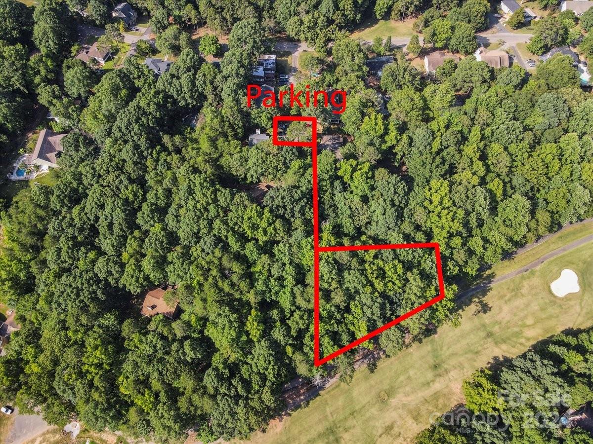 Make your dreams come true and build your dream home on this rare lot in this resort-like community near the Tega Cay Peninsula!  This private piece of land borders the 4th hole on Tega Cay's Cove Golf Course.  Previously voted the best Golf Course in Fort Mill SC.  Land has been surveyed and city water and sewer available; tap fees will apply, see city of Tega Cay for current fee schedule.  Land appraised for $44,000 in 2023.