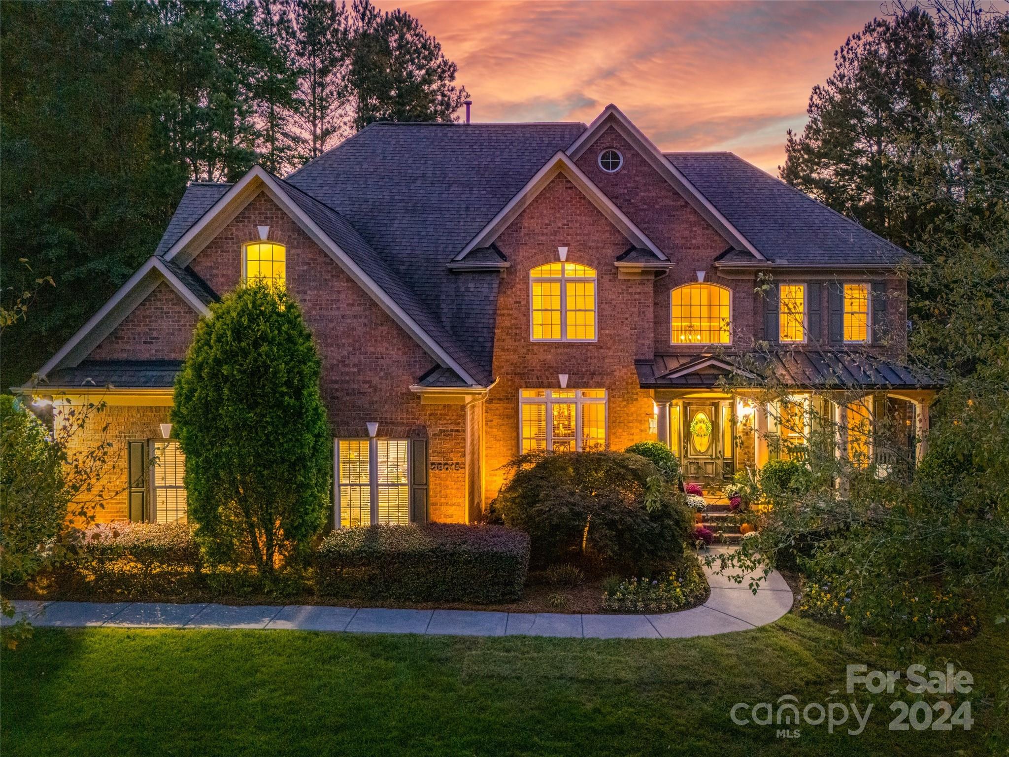 This GORGEOUS Bridgehampton full brick home with stunning curb appeal is one you do not want to miss!  Talk about an amazing sense of arrival with cul-de-sac location, lush landscaping and a beautiful front porch space. 
A John Wieland classic with a great open layout featuring over 4500 sq ft, 5 bedrooms, 4.5 baths and an abundance of natural light.  The first floor has a spacious office area off the foyer, guest bedroom + full bath, 2 story great room, + an updated kitchen perfect for entertaining! Head out to the private back yard to enjoy the tranquil screened in porch, additional paver patio area, & wood burning fireplace- perfect for the cozy Fall nights. Upstairs the expansive primary suite welcomes you to a spa like bath retreat, which is a showstopper!  Custom separate vanities w/ quartz, + expansive floor to ceiling tiled shower w/ double shower heads, + seat. 
The third floor is an amazing large bonus area w/ separate built-in bar, & 1/2 bath.
Showings start Friday!