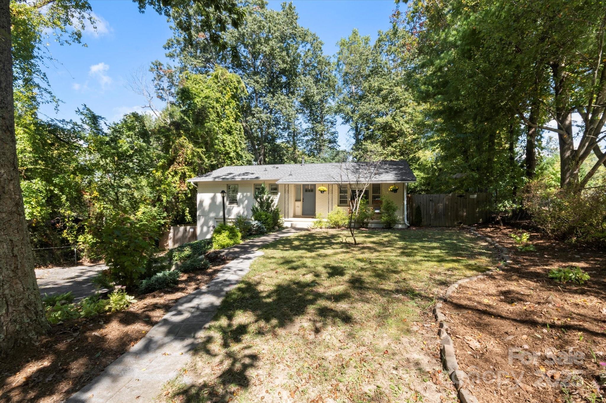 Welcome to this sweet 4-bedroom, 2.5-bath home in a well-established South Asheville–Arden neighborhood. A level front yard and inviting façade create a warm first impression. Inside, the welcoming foyer opens into a cozy, light-filled living area enhanced by hardwood floors and generous natural light. The updated kitchen offers modern appliances, stylish finishes, and ample workspace.

The spacious primary bedroom includes a full “Jack and Jill” bathroom with access from both the hallway and the bedroom. Two more bedrooms complete the main level.

Downstairs, you’ll find a large bonus room/bedroom, a partially finished recreation room, and another full bath—complete with its own exterior entrance. This versatile lower level is ideal for separate living quarters, multi-generational living, a workspace, homestay setup, or a dedicated playroom.

A charming side patio provides the perfect place to enjoy your morning coffee or unwind in the evenings. The fully fenced nd sunny backyard offers privacy and peace of mind, making this home an inviting retreat. There is also a sweet outbuilding for exterior storage and a firepit.

The home is offered fully furnished or unfurnished (buyer's preference) —an incredible value for such a beautiful property inside and out! All just a short stroll to Glenn Arden Elementary and minutes from South Asheville amenities and main connectors.


*** PRE-FORECLOSURE***