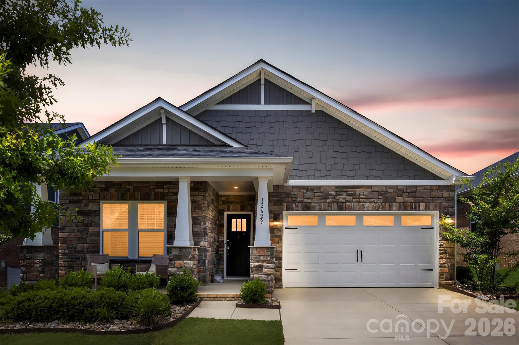 Freshly painted and move-in ready, this home has a desirable 1.5 story layout and offers sought-after main-level living with both the primary suite and a guest bedroom on the first floor. Relax on the covered front porch before stepping inside to an open floor plan featuring a spacious kitchen with stainless steel appliances, a large center island, walk-in pantry, and seamless flow into the living and dining areas. The main level also includes a welcoming foyer, convenient drop zone, and flex space ideal for a home office, study, or hobby room. Upstairs, the bonus room provides additional living space for a media room, playroom, or guest retreat. Additional features include walk-in closets and abundant storage throughout. Conveniently located between Mint Hill and Matthews with easy access to US-74 and I-485, this home is just minutes from shopping, dining, and everyday conveniences near Mint Hill Commons and downtown Mint Hill. Schedule your showing today!