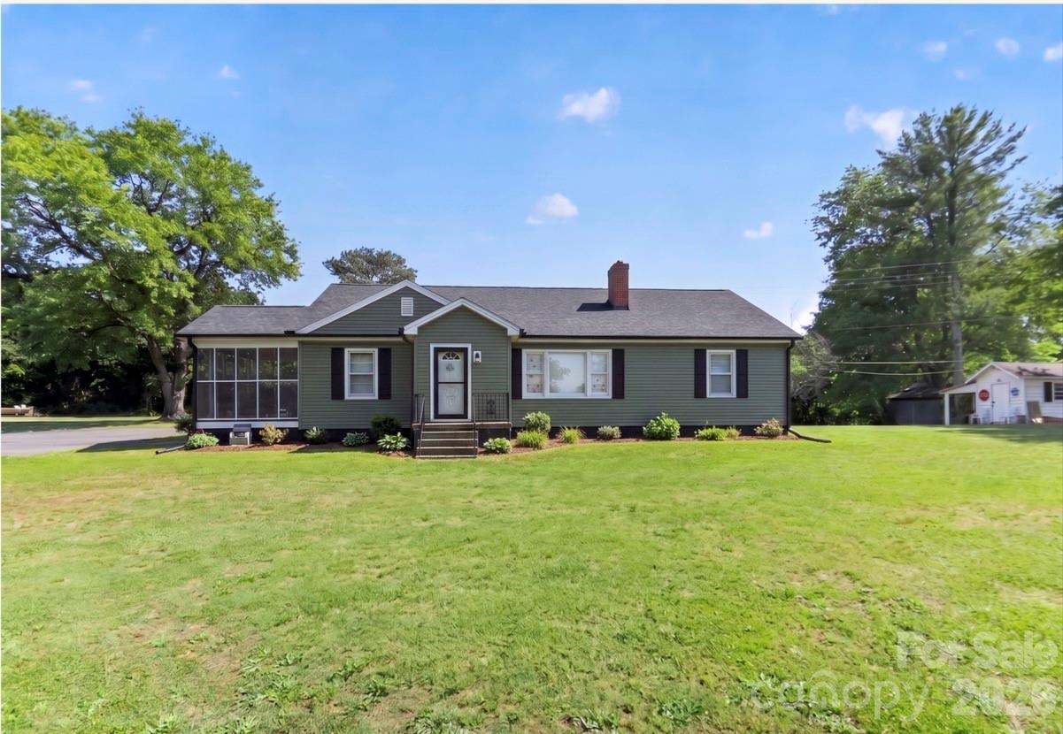 Escape to peaceful country living on over an acre with no city taxes! This charming 3-bedroom, 2-bath home offers more than 1,600 heated square feet with a versatile layout designed for comfort and flexibility. The spacious front flex room can easily serve as a home office, playroom, formal dining area, or additional living space.

Enjoy relaxing mornings and evening gatherings on the large screened-in porch overlooking the private fenced backyard — perfect for entertaining, pets, or simply enjoying the outdoors. The property also includes two outbuildings, offering excellent storage, workshop, or hobby space.

Major exterior updates within the last two years provide peace of mind, including new vinyl siding and shutters, new gutters and downspouts, architectural shingle roof, and a newly paved oversized driveway with ample parking. Additional recent improvements include a new heat pump (2024) along with new front and back doors, framing, and storm doors.

Conveniently equipped with county water availability, natural gas availability, and septic system already installed. If you’re looking for space and privacy with the charm of country living, this property is a must-see!

FYI 1)House is on county water so seller didn't use the existing well 2)The paved driveway belongs to the property. The neighbor to the left has always used the same entrance even prior to the seller's possession of the property. There is not a written agreement for sharing/maintenance in place, so this could be changed. 3)No septic records are currently available; however, the seller informed us that he pumped and cleaned the septic system on March 13, 2024. 4)The seller is keeping the washer and dryer and is leaving the fridge and the stove for the new buyer.