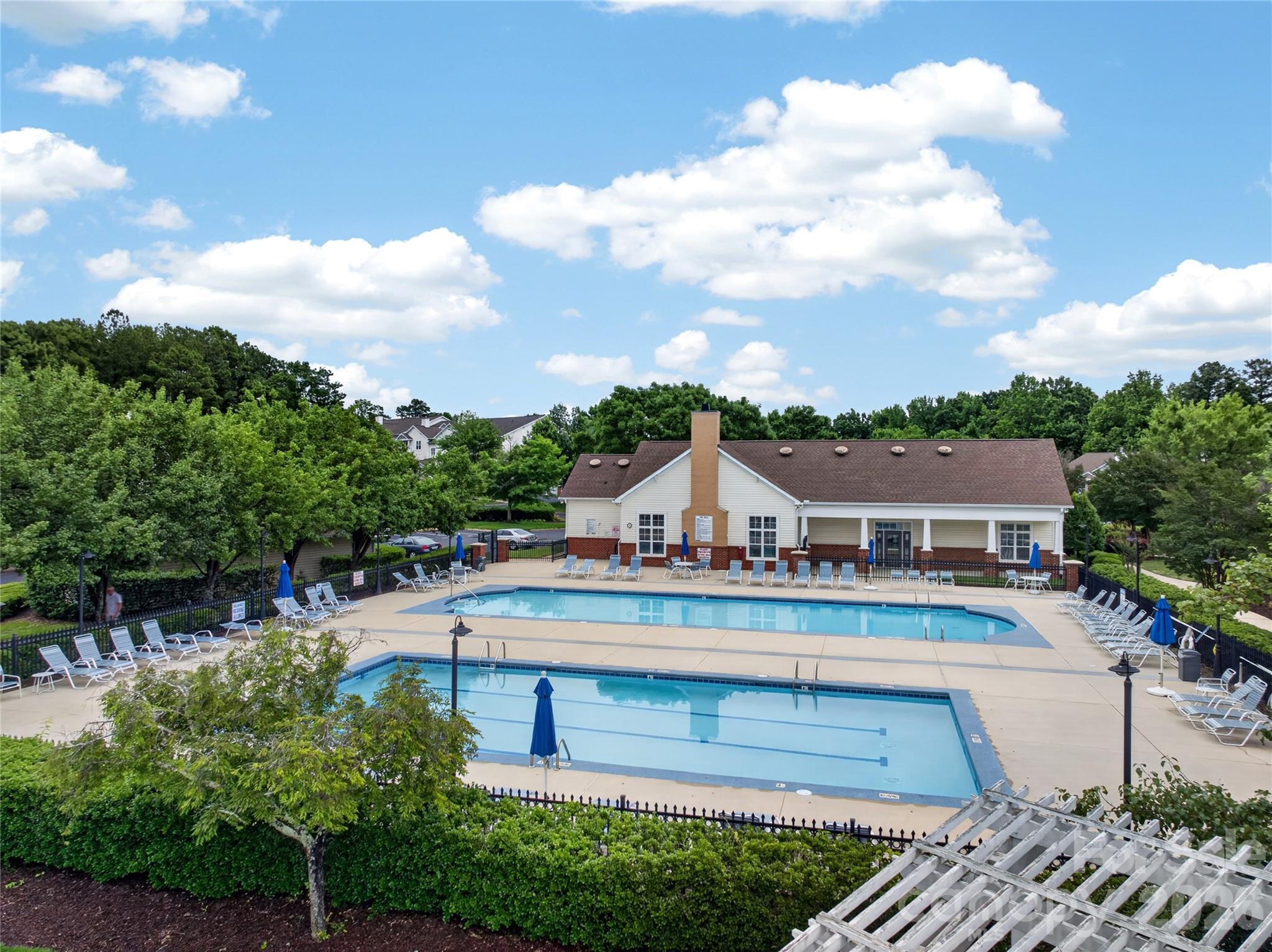 BALLANTYNE... Premium Location & Top Schools... Pools, Tennis, Clubhouse, Fitness Center, Picnic Area, Recreation Space, Sidewalks & Street Lights! Just across from The SHOPPES at ARDREY KELL... including Harris Teeter, Big View Diner, Oggi Italiano, QDoba, Lights Cafe, Italian Ice, Shops, Medical, Grocery, and More!!! Just 2 Miles to BALLANTYNE VILLAGE With Boutique Shopping, Dining, Coffee, Grocery, Medical, Business & Wellness Services... 3 Miles to BALLANTYNE BOWL With New Restaurants, Shops & Fabulous Entertainment in the New Outdoor Amphitheater at The AMP BALLANTYNE and access to I-485! Incredible Location So CLOSE TO EVERYTHING!!! Inviting Entry Foyer With Hardwood Floors That Extend Throughout Main Living Areas... Large, Open, Great Room With Ceiling Fan and French Door to Private Covered Porch... Dining Room With Chair Rail Molding and Convenient Service/Breakfast Bar Opens to Great Room and Kitchen... Gourmet Kitchen With Beautiful Upgraded Cabinetry, Lots of Storage, and ALL APPLIANCES TO REMAIN... Stainless Refrigerator, Dishwasher, Range/Oven, Microwave and Full Size Washer/Dryer! Large Laundry Room Off Kitchen With Plenty of Extra Room For Stored Items. Two Spacious Bedrooms and Two Full Baths... Primary Bedroom with Walk-In Closet... Covered Porch Has Utility Closet For Additional Storage! MOVE-IN READY... Top Rated School District... Sought-After South Charlotte Location With New Businesses Frequestly Coming In - Reid's Fine Foods & Catering Has Officially Opened It's Ballantyne Location & The Famous WEGMANS Grocery Store is Making It's Charlotte Debut in Ballantyne Opening Fall 2026! With Private Pools, Tennis, Fitness, Clubhouse & More On-Site, You Can Enjoy Summer and the Year-Round Luxury of RESORT-STYLE LIVING EVERYDAY!!!