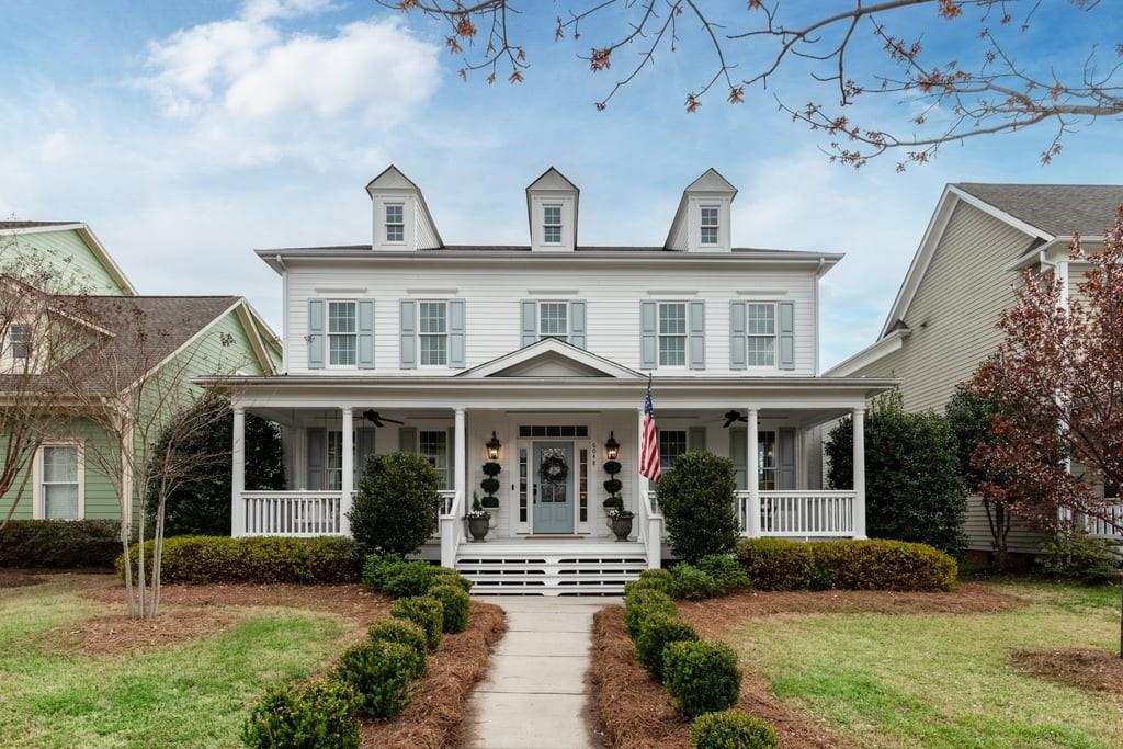 Located in the highly desirable neighborhood of Baxter Village, this stunning home is situated in a private and secluded area of the community. You will love the curb appeal of this amazing front porch, perfect for rocking chairs and porch swings. Inside, the home features beautiful hardwood floors throughout and a main level private office perfect for working from home. This oversized kitchen is a chef's dream and has recently been updated to include stainless steel appliances and gorgeous quartz countertops. Upstairs, the spacious primary suite is a perfect retreat after a long day. Additionally, upstairs includes three more bedrooms, two more full bathrooms, the laundry and a large bonus room! The fully fenced backyard provides a great space for outdoor entertaining and is ready for your furry friends. As a resident of Baxter Village, you have access to an array of amenities, including two community pools, tennis courts, walking trails and the ever popular Fort Mill School District!