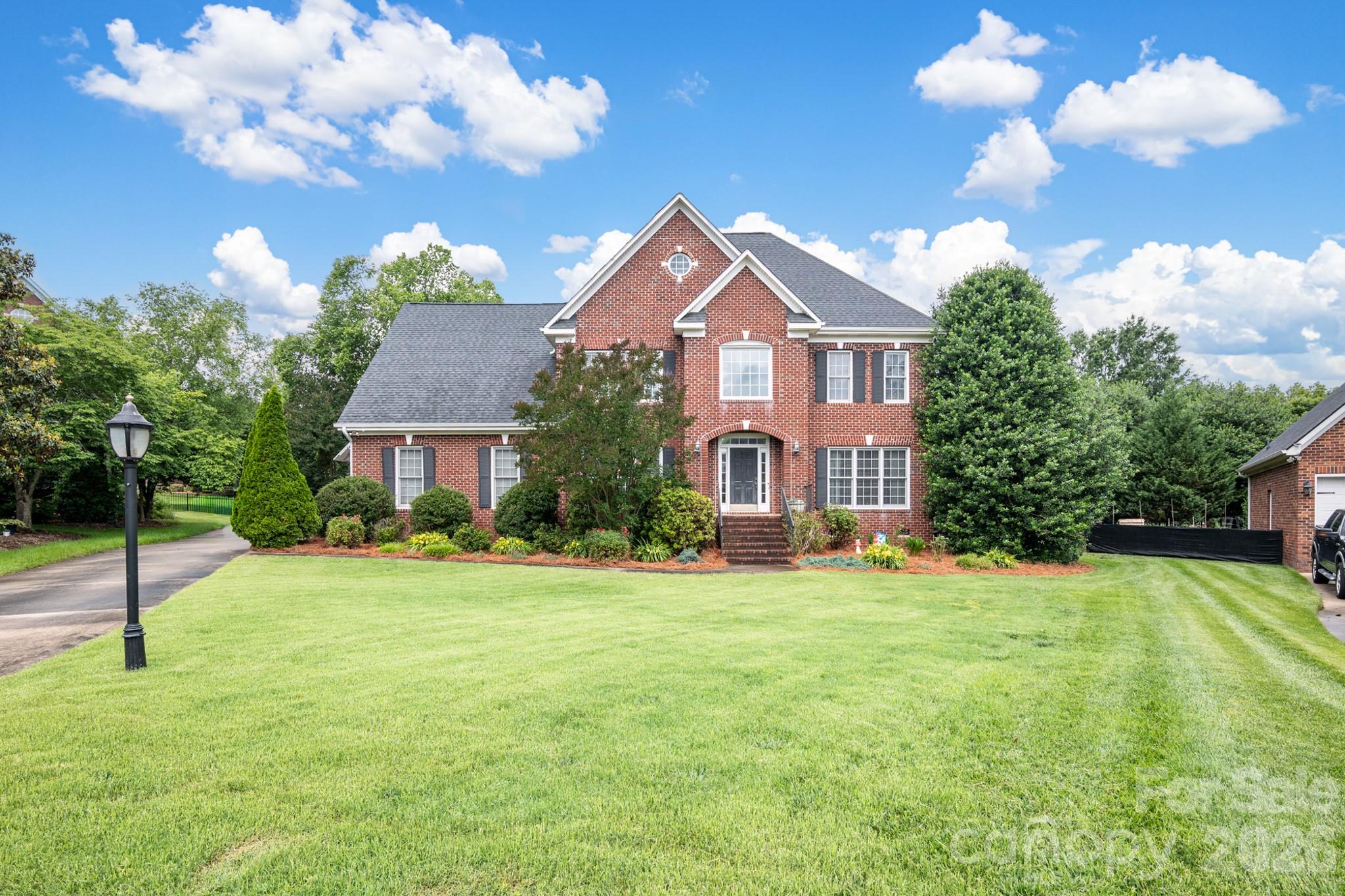 MOVE IN READY! This beautifully maintained 3-story, 5-bedroom, 4-bath brick, cul-de-sac home offers exceptional space and modern updates that greet you with a dramatic 2-story foyer and rich wood flooring throughout the main level. The formal dining room is perfect for entertaining, featuring a tray ceiling, crown molding, chair rail, and elegant wainscoting. Adjacent is the spacious living room with a cozy gas log fireplace. A private mother-in-law suite on the main level includes its own full bath, offering versatility for guests or extended family. The heart of the home is the fully remodeled kitchen (2020) boasting granite countertops and island, breakfast bar, tile backsplash, stainless steel appliances (including refrigerator), and a stylish wall-mount double oven. Upstairs, the primary suite is a true retreat with a tray ceiling, huge walk-in closet room, and luxurious bath featuring his-and-her sinks, jetted tub, separate shower, and private water closet. All guest bedrooms offer walk-in closets, and the large bonus bedroom includes its own en-suite full bath and walk-in closet. Additional storage is abundant with a walk-in attic room and a laundry room complete with cabinets, washer, and dryer.
Outdoor living shines with a 3/4 fenced backyard featuring a large patio, 6-seat hot tub, fire pit, and mature trees for privacy. The 3-car finished garage includes convenient wood shelving. Recent updates include a new roof (2020), new 4.5-ton heat pump for the upper level (2021), and a new gas furnace (2023).