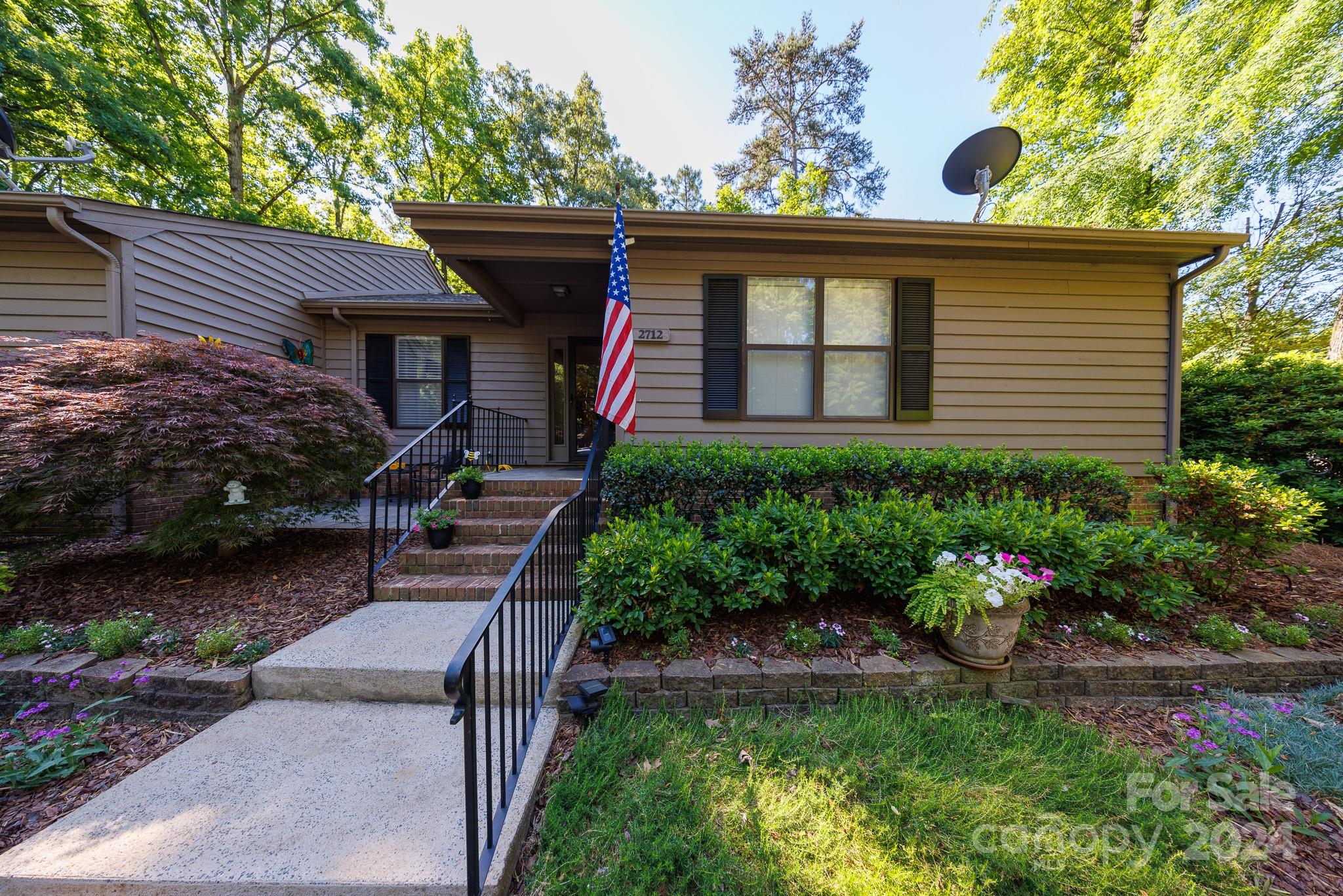 Meticulously maintained single level end unit condominium in popular Dogwood Hills. Delightful 2 bedroom, 2 bath unit offers so many updates and features.  Beautiful updated kitchen with painted grey cabinets, hard surface counter tops, newer white appliances and beautiful wood grain luxury vinyl plank throughout the entry, kitchen, breakfast, laundry room, dining room, great room and sunroom.  New carpet in both bedrooms as of May 2024.  Decorator paint colors throughout.  Roof was replaced app. 5 years ago and exterior was painted in 2023.  Updates include new hot water heater 2023, new heat pump 2020 and rustic wood cabinet was added to be used as a pantry and remains.   All appliances in home are included.  Seller will consider offering furnishings excluding a few personal items. (artwork, silverware & blower) Enjoy the beautiful great room with the fireplace or move out to the sunroom and enjoy the light from the windows. Relaxing tiled patio completes this beautiful home.