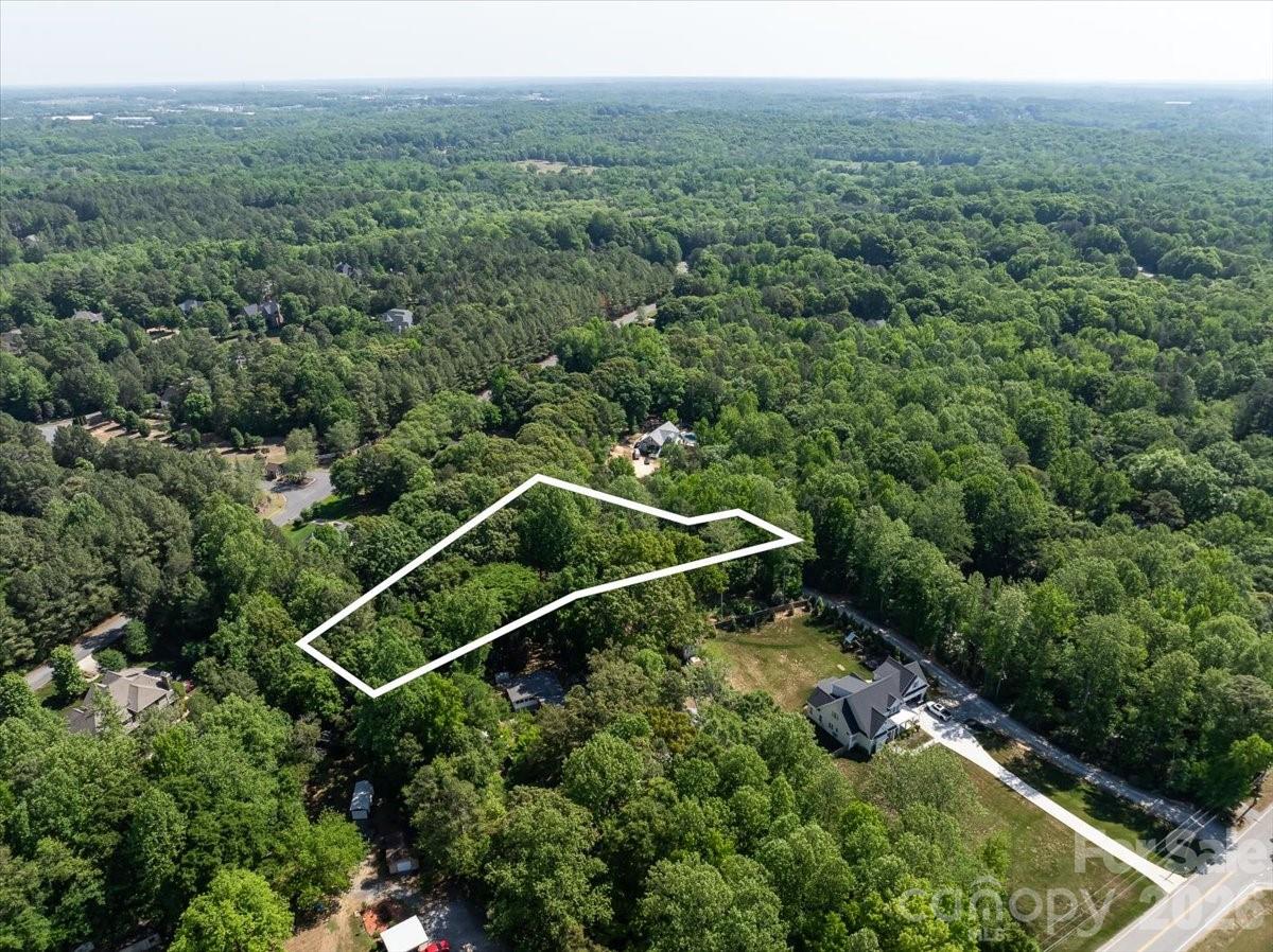 1.5-acre lot in desirable Fort Mill with a private setting and no HOA. Great opportunity to build with added flexibility. Showings by appointment with an agent only.