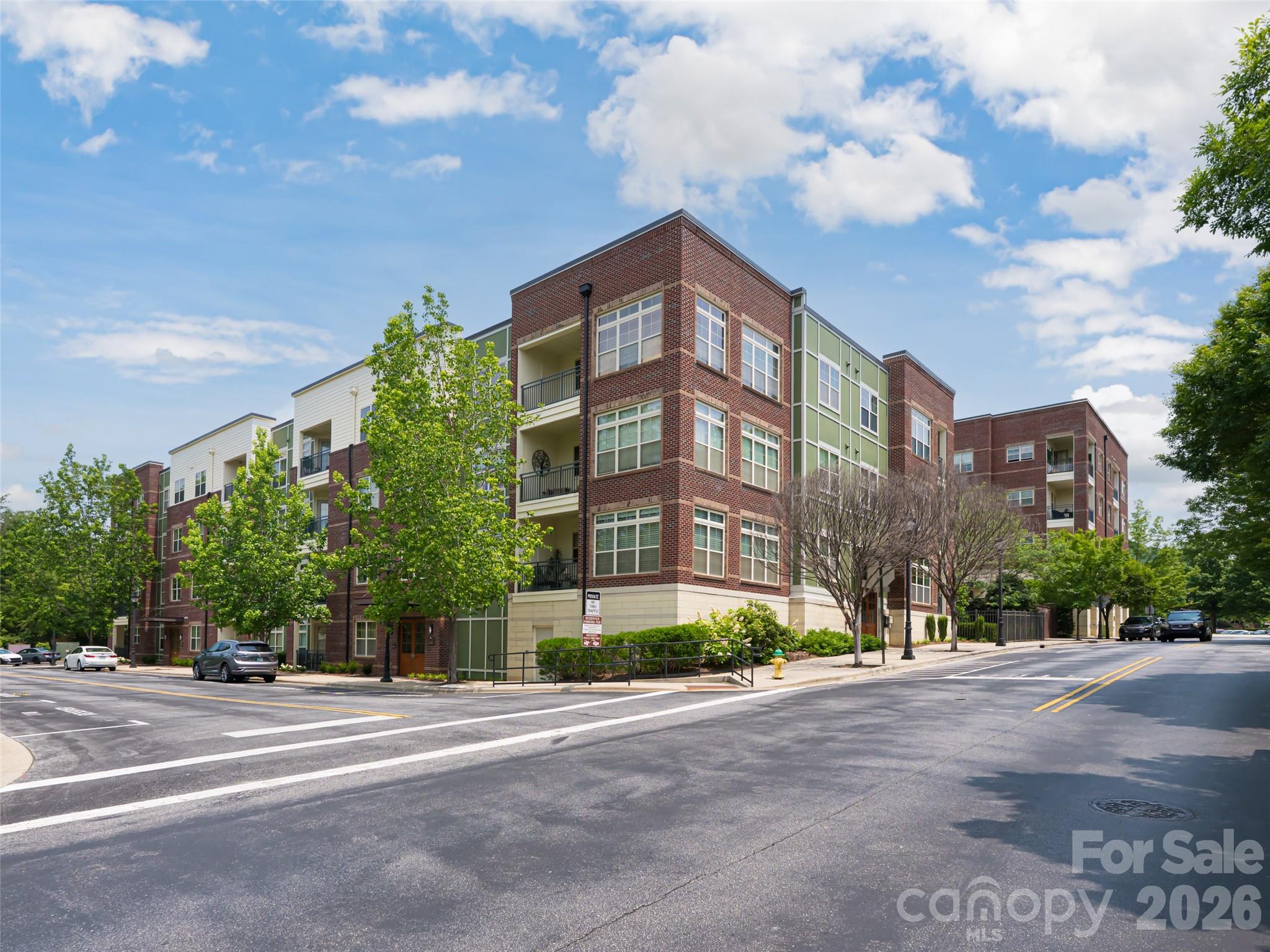 Experience walk-to-everything convenience in this Biltmore Park condo. This light-filled, open-plan home features granite counters, hardwood floors, and a private balcony. Enjoy a split-bedroom layout, premium amenities—including a pool and fitness center—assigned parking, and storage. Just minutes from Asheville Airport, it’s the perfect residence or savvy investment opportunity.