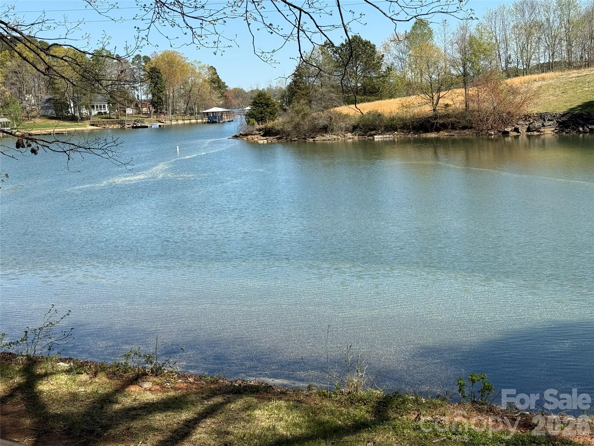 Impossible to find acreage for possible development with over 500 FEET OF FLAT WATER FRONTAGE ON LAKE NORMAN with year round deep water!  These 5 parcels are owned by 2 families who are ready to sell all 5 parcels together (will not sell off pieces).  Whether you are looking to build a private waterfront estate or to develop the roughly 3.5 acres together, this opportunity is quite rare!  There are currently 2 residences (value is in the land) and 2 boat docks in place.  With over 500' of water frontage, there is the potential to have 5 separate docks (subject to approval).  Any way you look at it, the potential for development is limitless!  This property is on the West Side of Lake Norman and is close to a ton of new commercial development.  Publix is less than 7 min from the property and there are more things already under construction close by!  This opportunity does not present itself very often.  Please call the listing agent for information on all of the parcels included in the offering.
